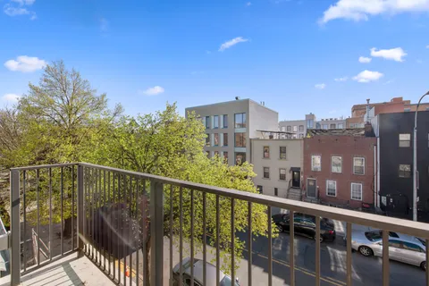 a view of a balcony with city view