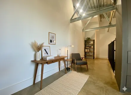a view of a balcony with chairs