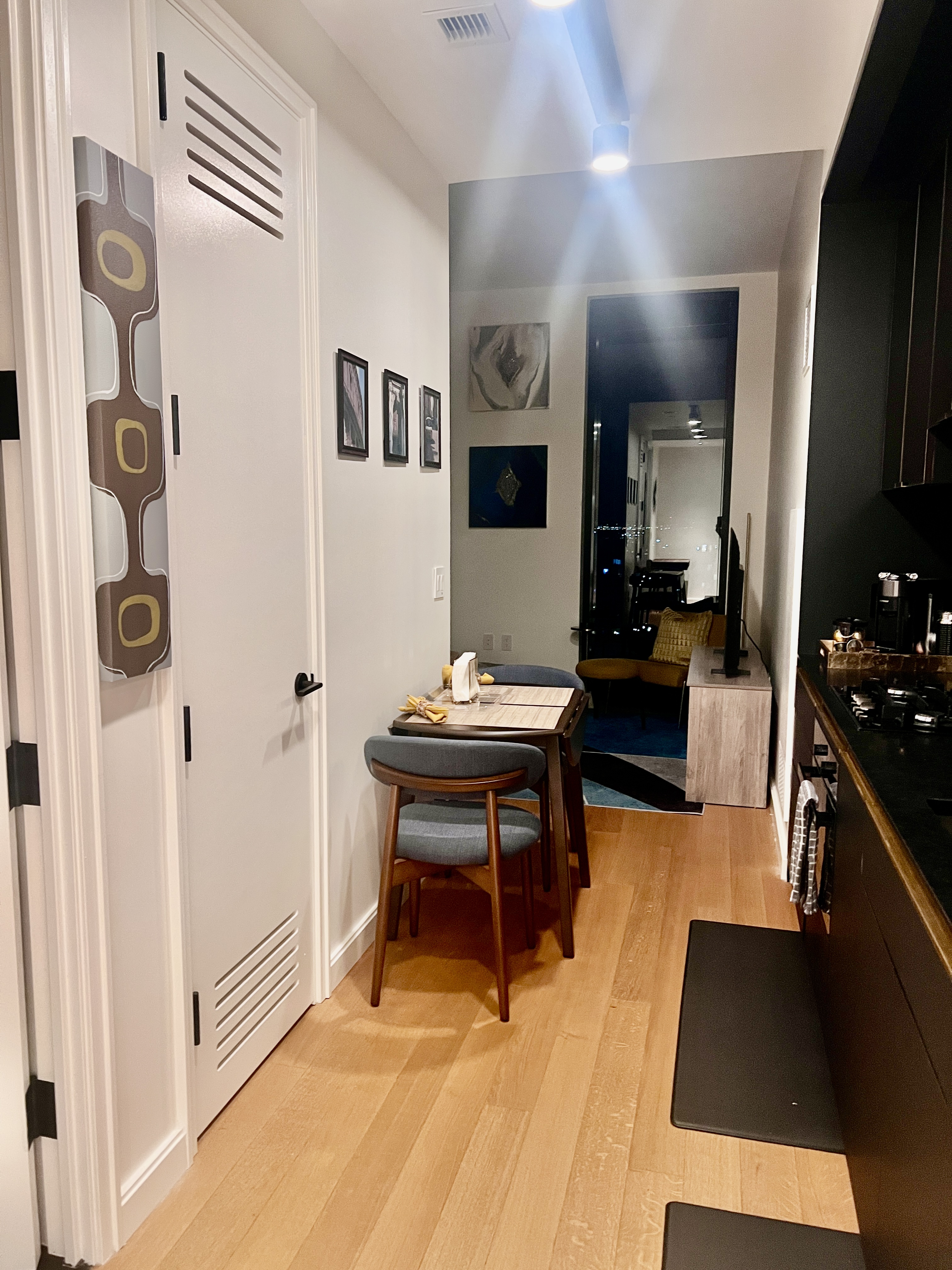 Address Upon Request Brooklyn, NY 11201 - Photo 5 of 12 a living room with furniture a flat screen tv and kitchen view