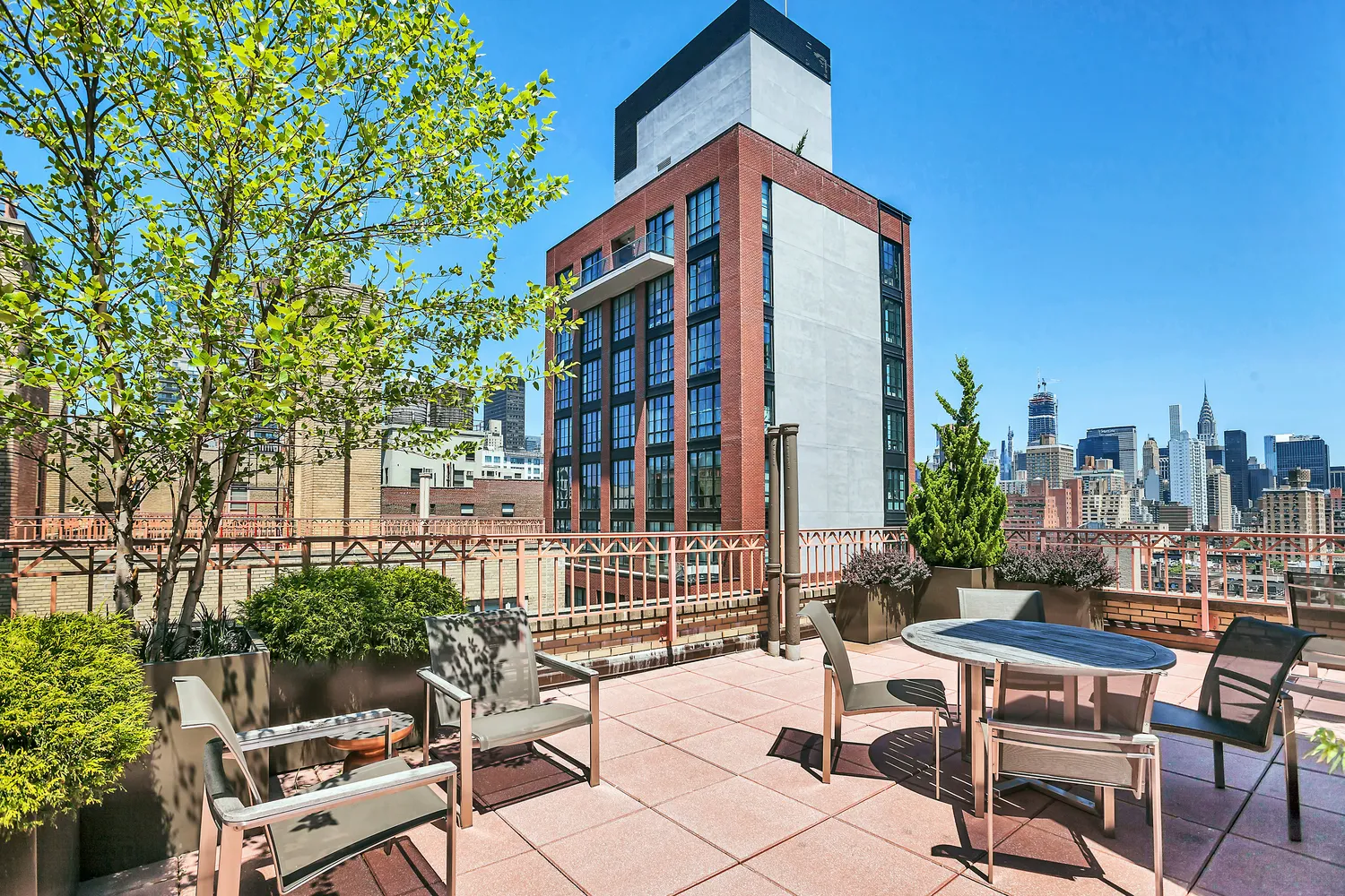 a view of a chairs and table in the patio