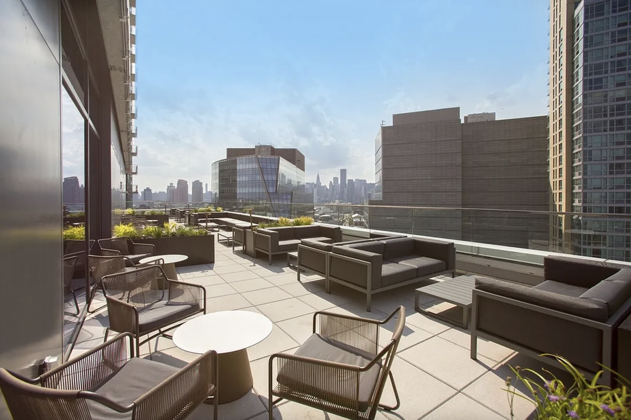 43-25 Hunter Street, Unit 4312W Queens, NY 11101 - Photo 10 of 16 a view of a terrace with chairs