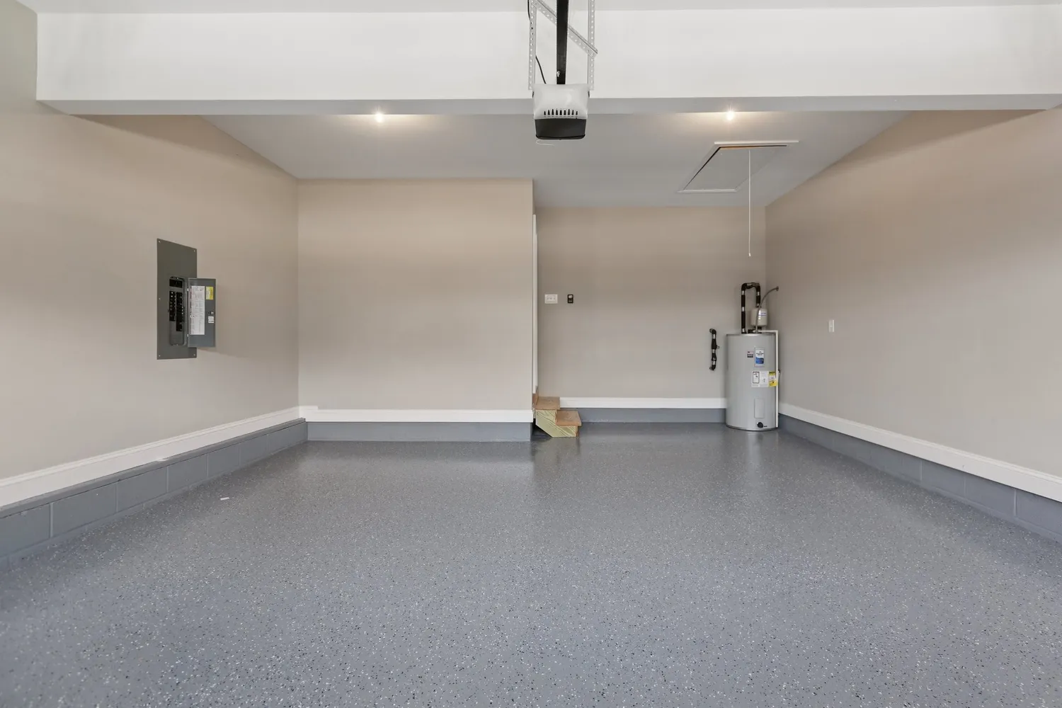 an empty room with windows and ceiling fan