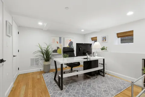 a living room with furniture and a rug