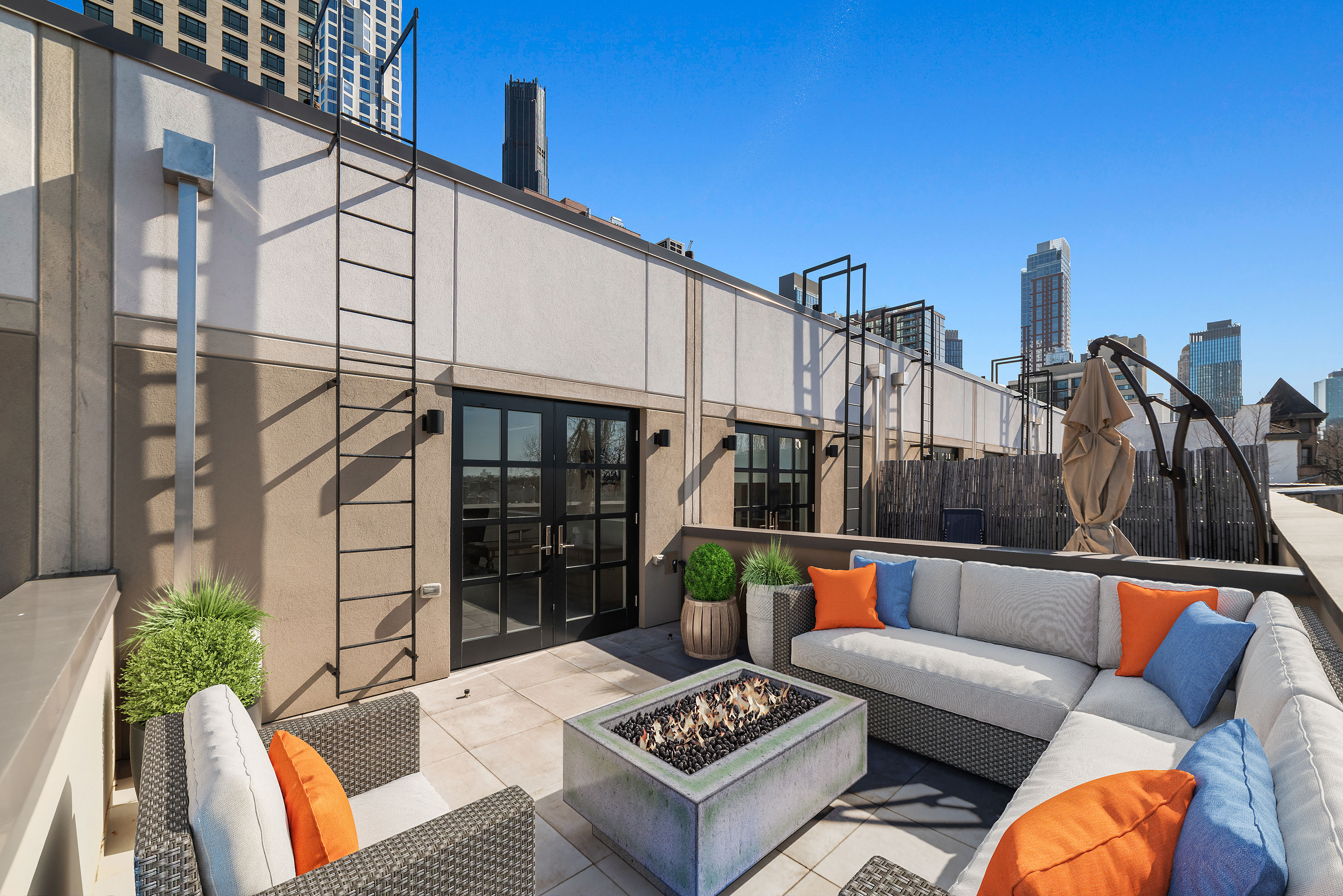 a view of a patio with couches and potted plants