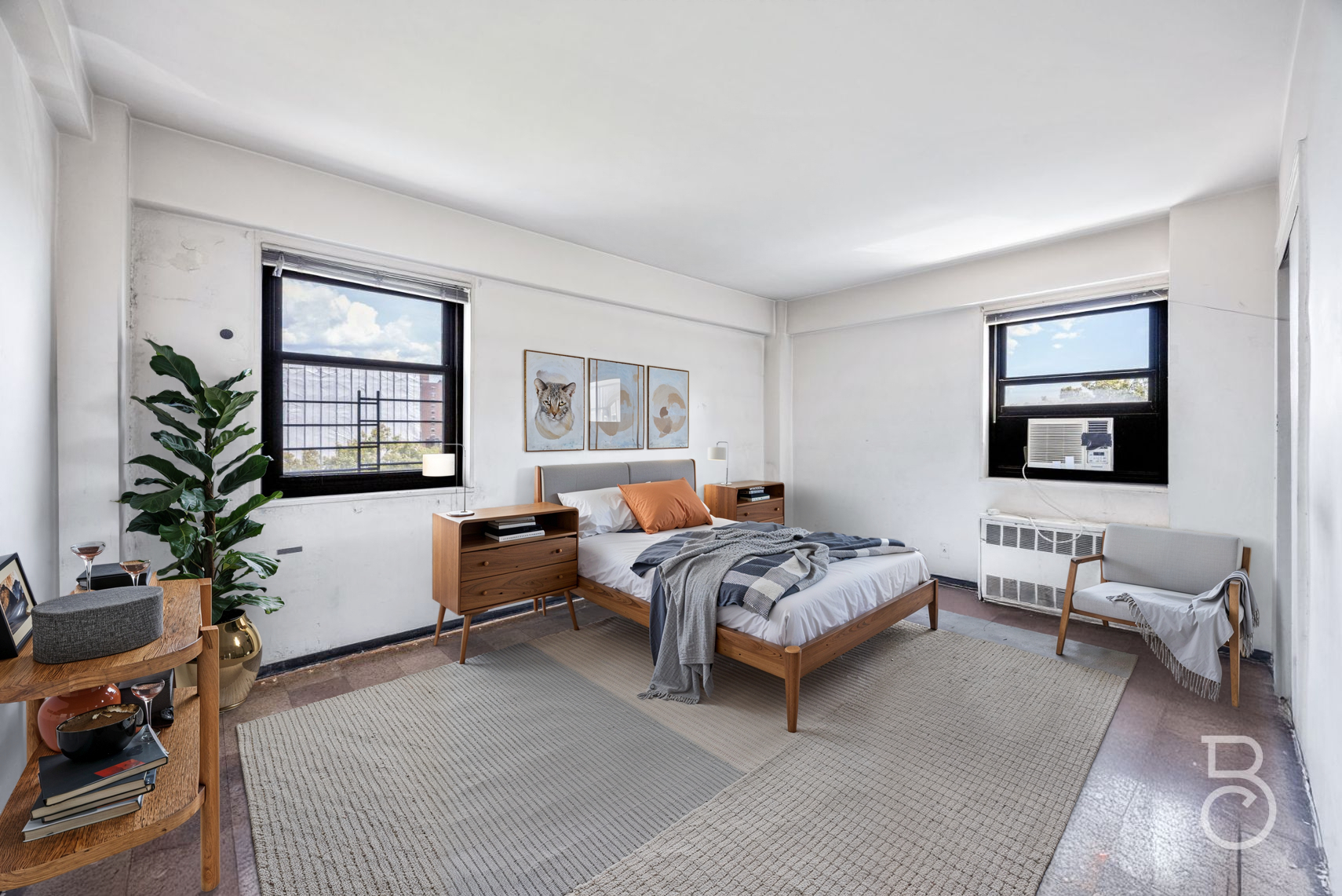 33-47 14th Street, Unit 6D Queens, NY 11106 - Photo 6 of 12 a bedroom with furniture and a window