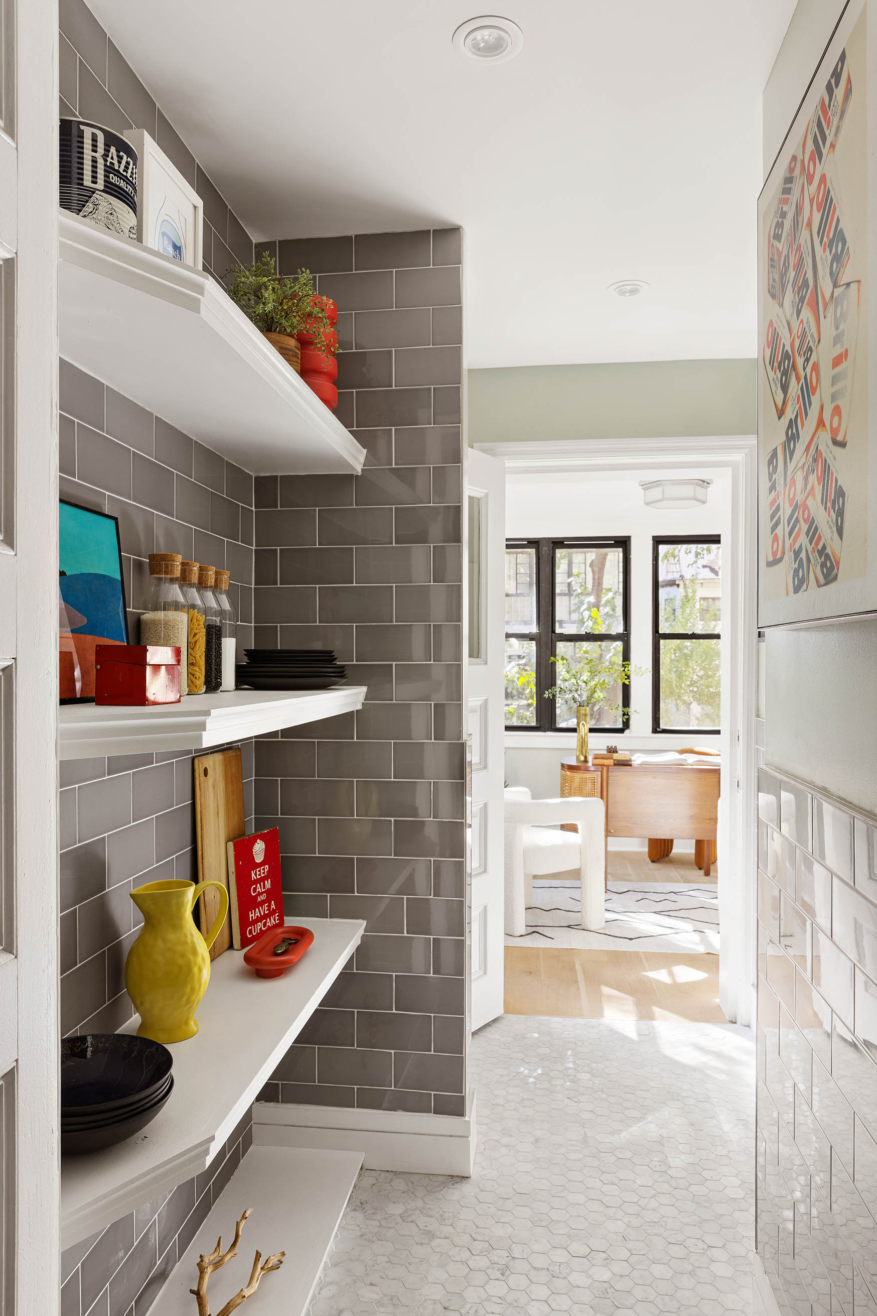 614 West 146th Street, Unit 4FAM Manhattan, NY 10031 - Photo 13 of 18 a room with lots of white furniture and a chandelier