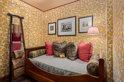 a bed room with a bed and a window