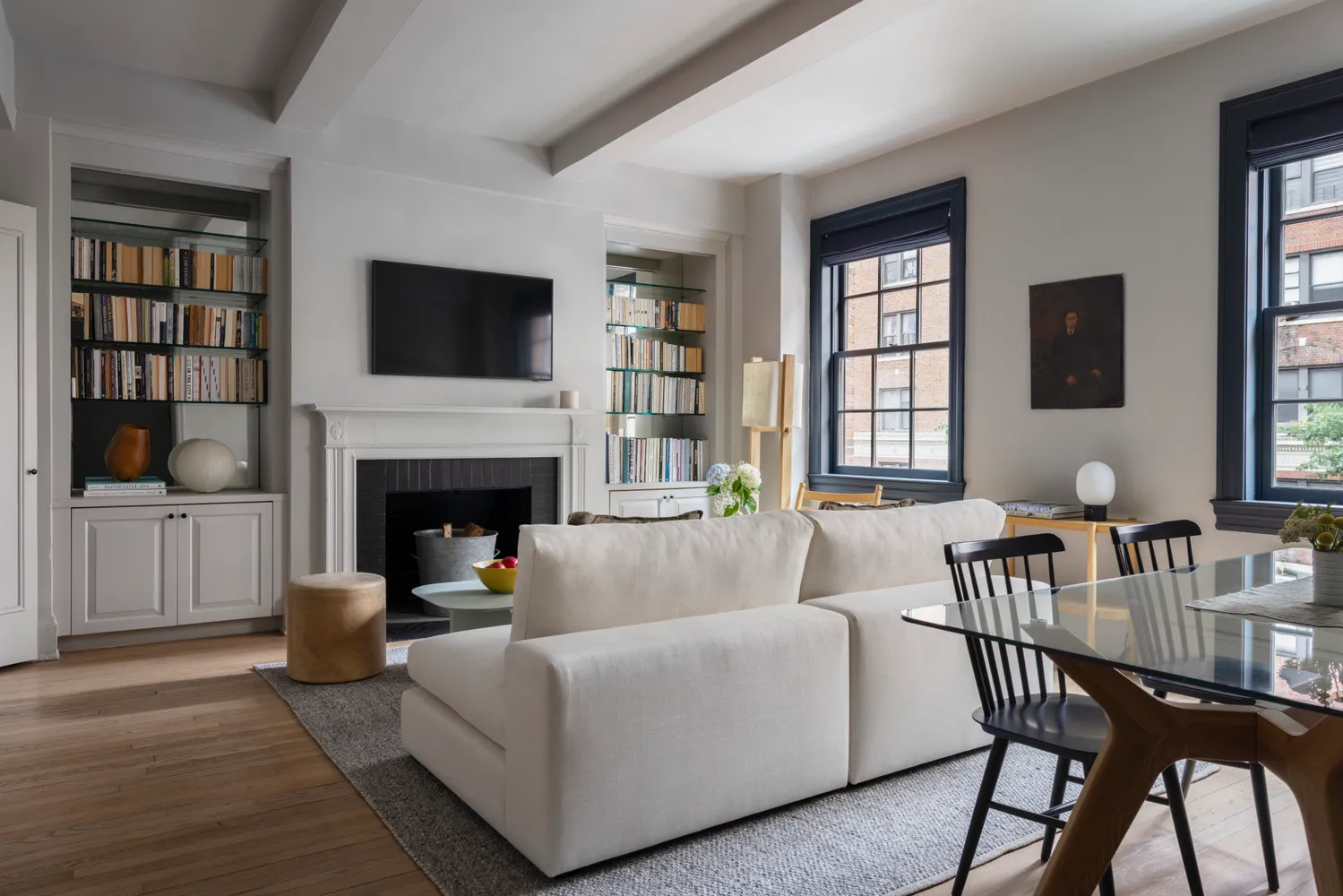 a living room with furniture fireplace and a flat screen tv