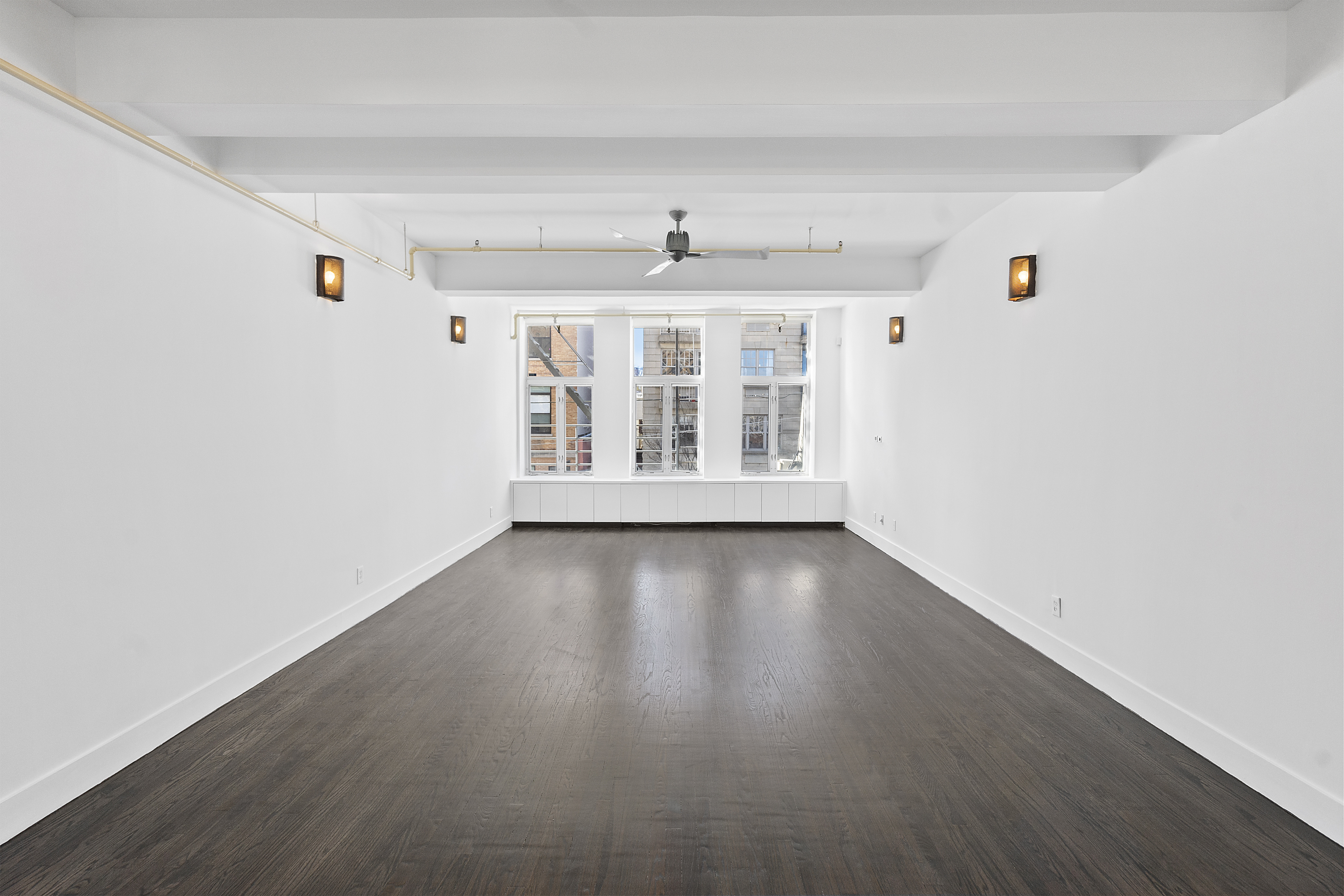 91 Grand Avenue, Unit 2D Brooklyn, NY 11205 - Photo 3 of 16 wooden floor in an empty room with a window