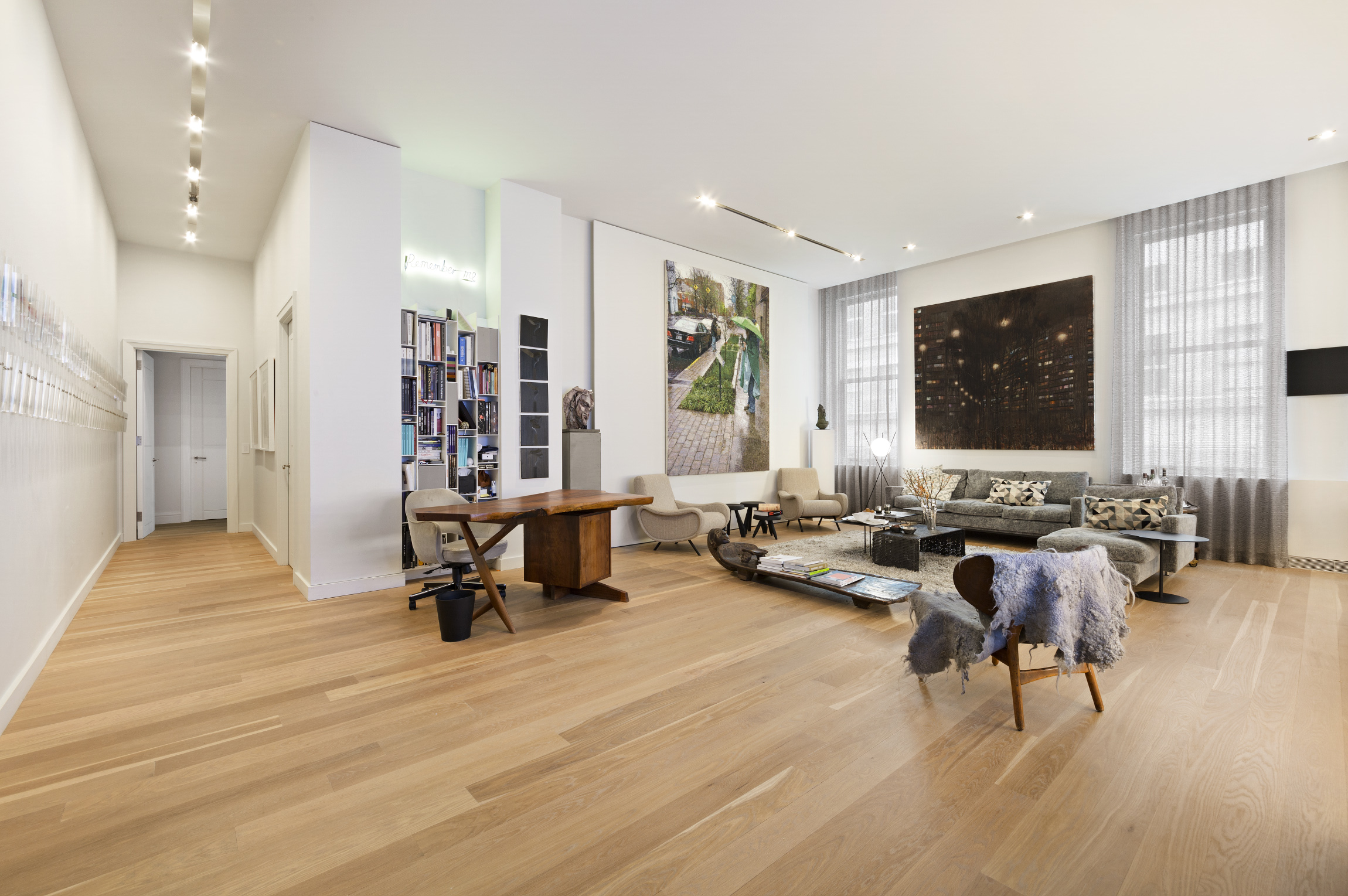 71 Laight Street, Unit 2E Manhattan, NY 10013 - Photo 2 of 12 a living room with furniture and a flat screen tv