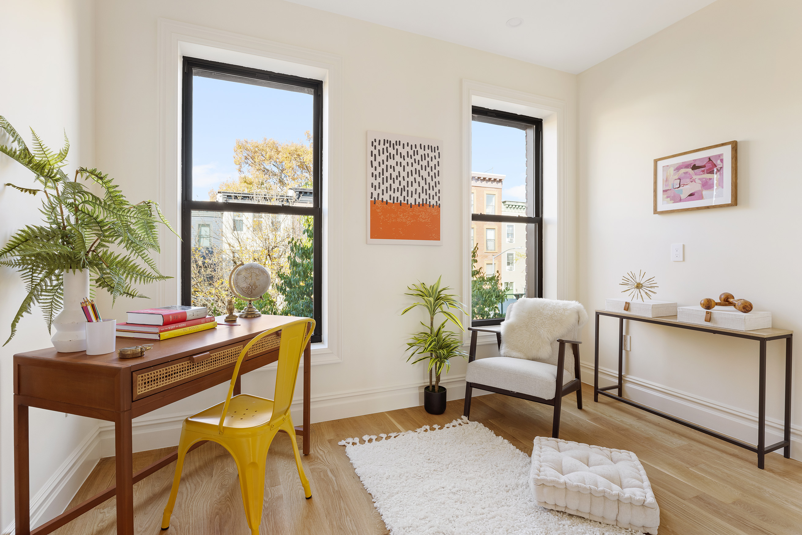 198 Madison Street, Unit SF Brooklyn, NY 11216 - Photo 14 of 19 a living room with furniture and a potted plant