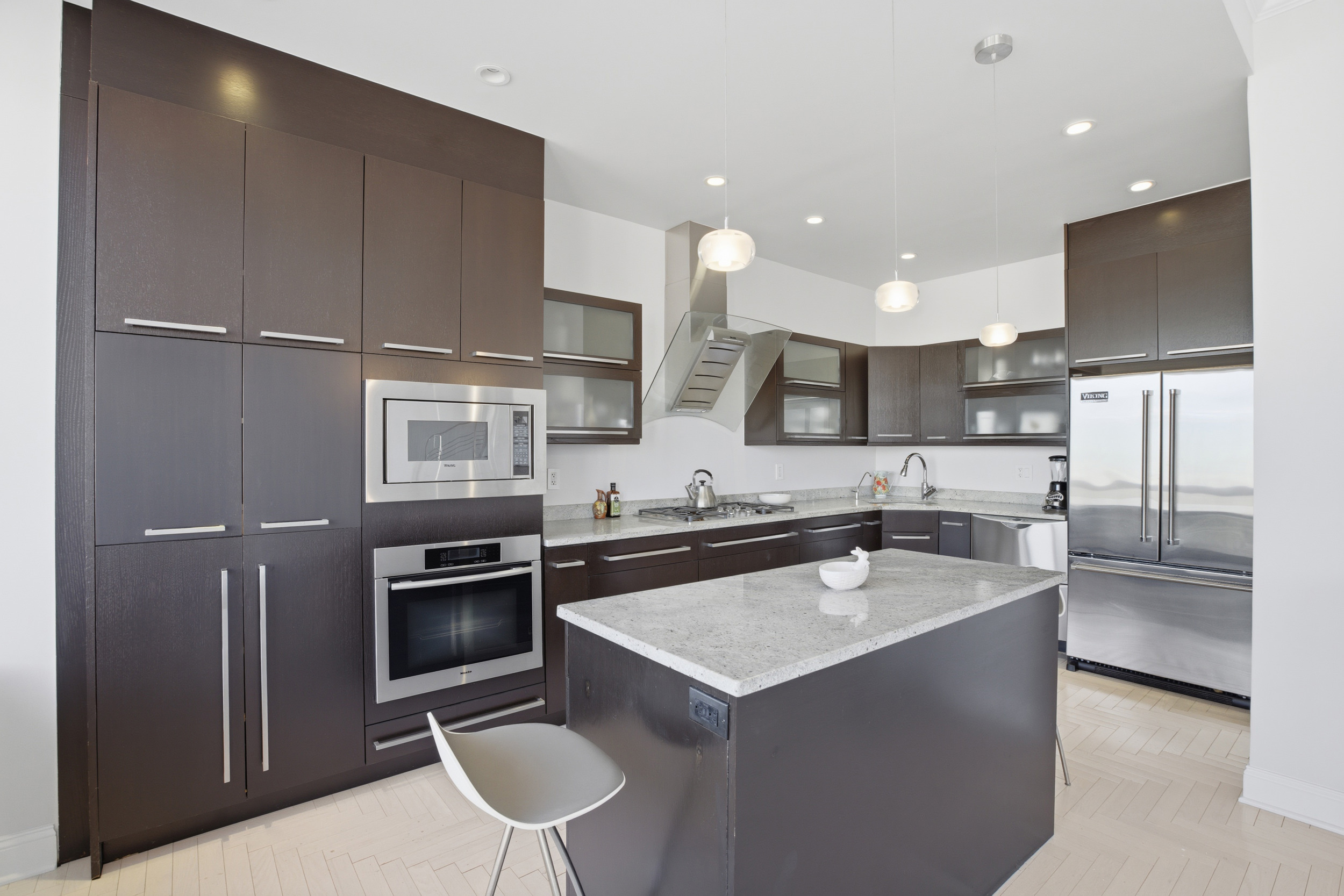 418 East 59th Street, Unit PHA Manhattan, NY 10022 - Photo 4 of 17 a kitchen with a sink stainless steel appliances and cabinets