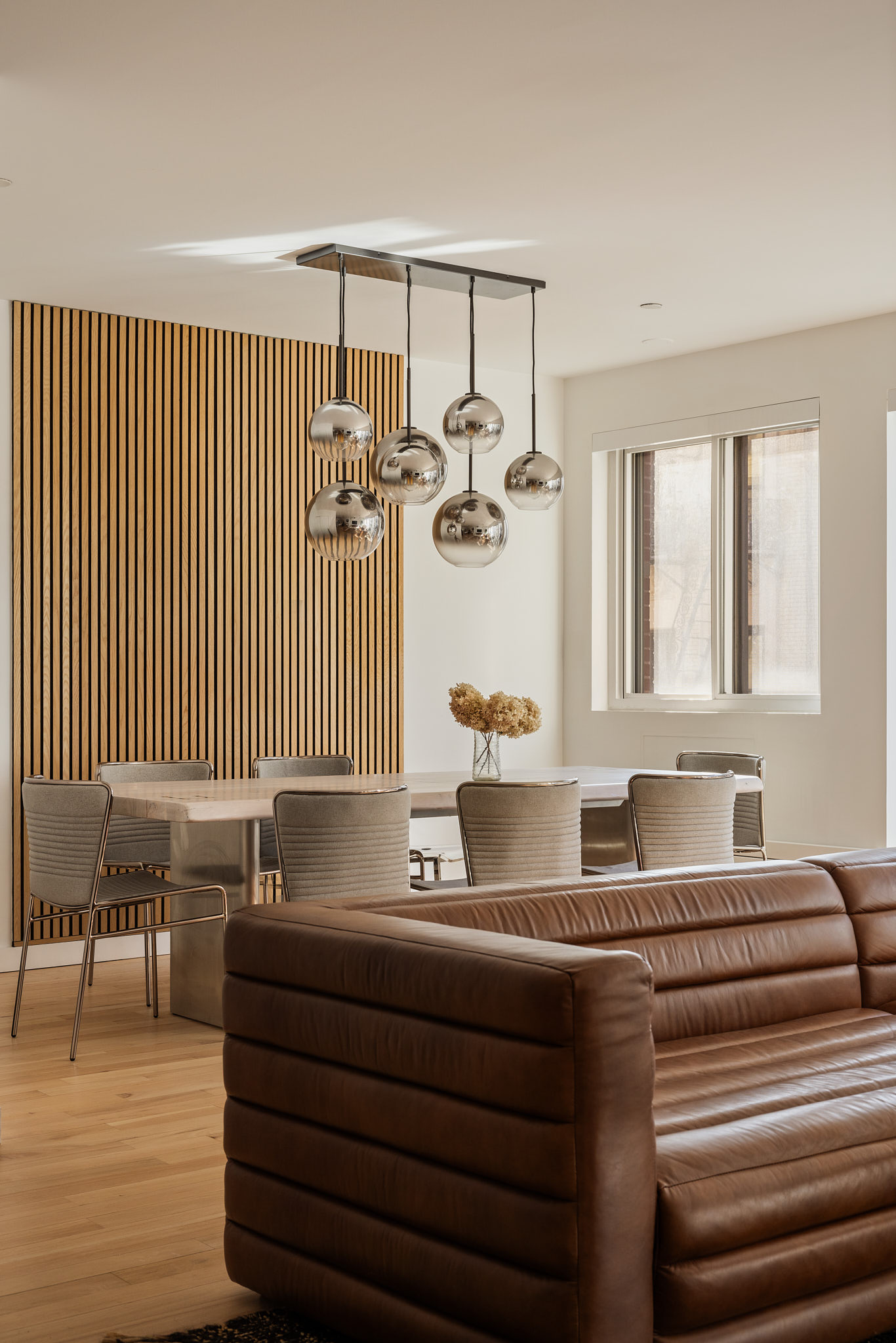 182 Mulberry Street, Unit 4 Manhattan, NY 10012 - Photo 5 of 13 a living room with furniture and wooden floor