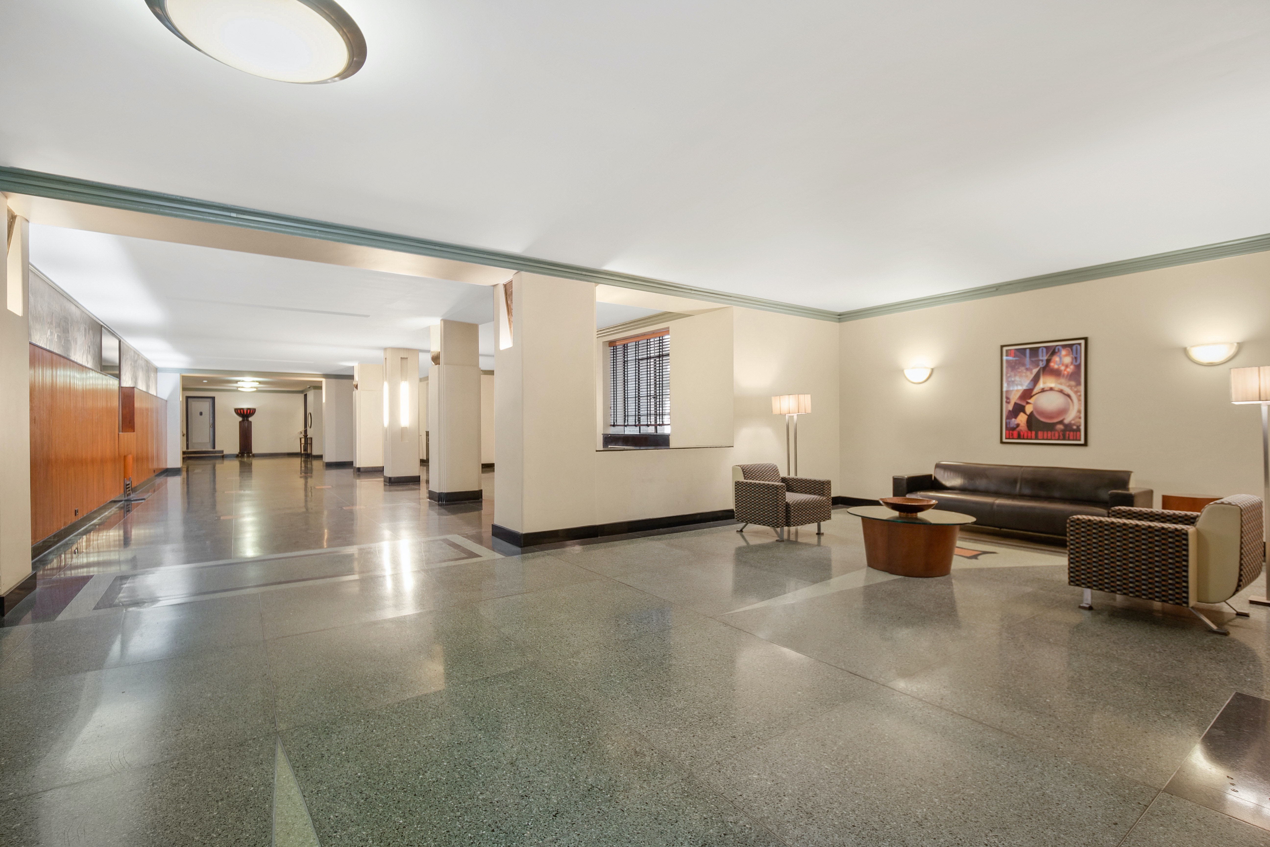 720 Fort Washington Avenue, Unit 5D Manhattan, NY 10040 - Photo 12 of 17 a living room with furniture and a flat screen tv