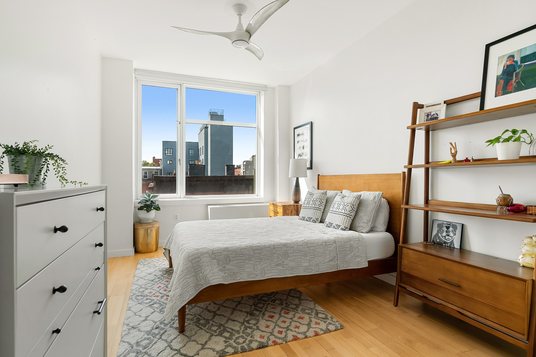 1 Powers Street, Unit 404 Brooklyn, NY 11211 - Photo 5 of 14 a bedroom with a bed and wooden floor