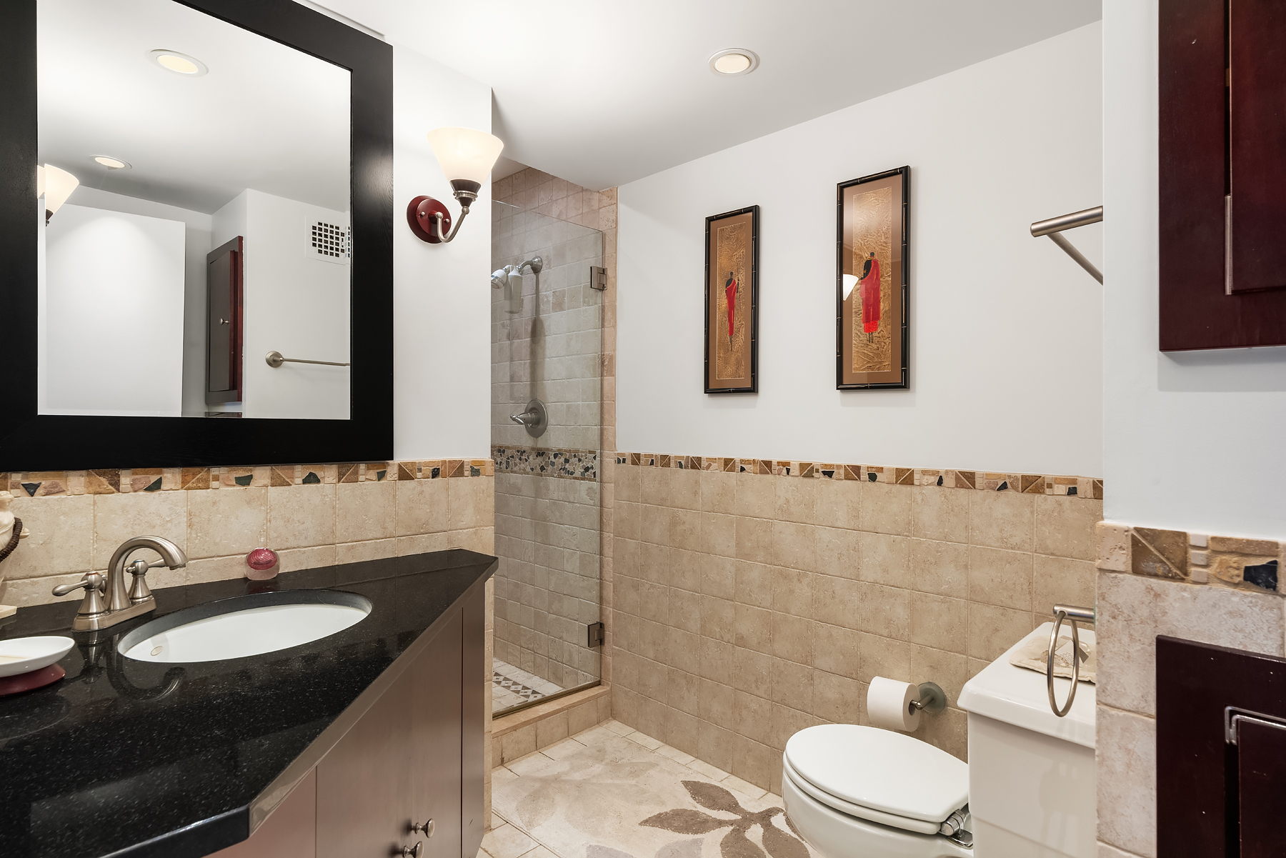 248 East 31st Street, Unit 1D Manhattan, NY 10016 - Photo 10 of 13 a bathroom with a granite countertop sink mirror and toilet