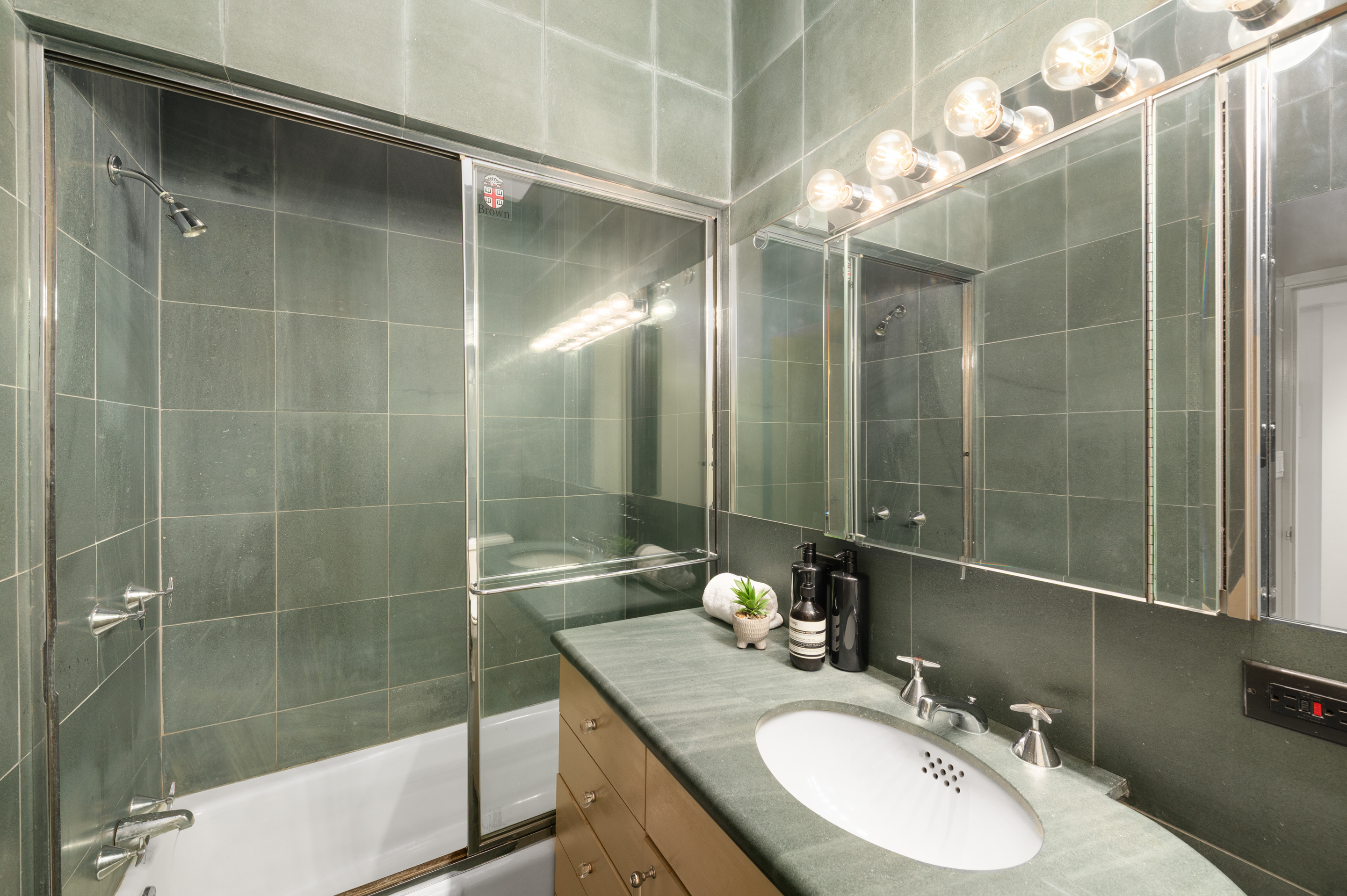 126 West 78th Street Manhattan, NY 10024 - Photo 18 of 39 a bathroom with a double vanity sink mirror and shower