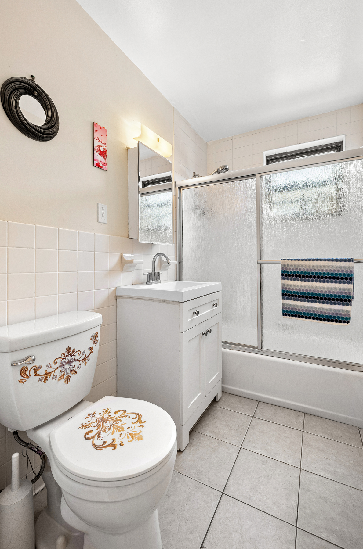 106 Crescent Street Brooklyn, NY 11208 - Photo 7 of 18 a kitchen with a sink a stove and a refrigerator