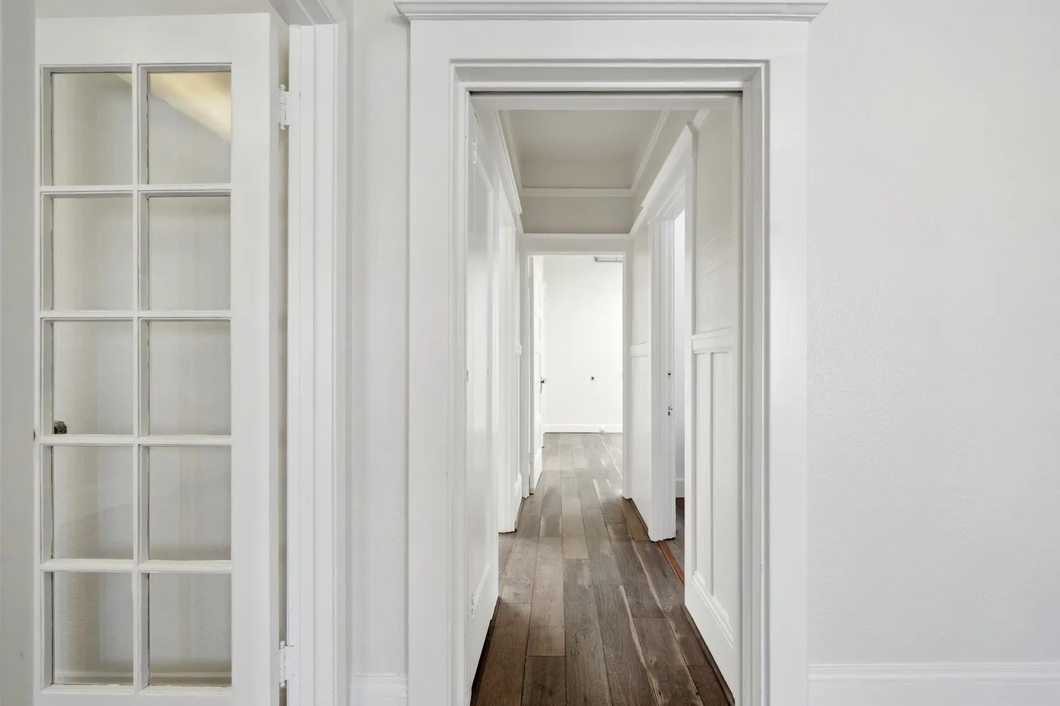 a bathroom with a granite countertop toilet and a sink