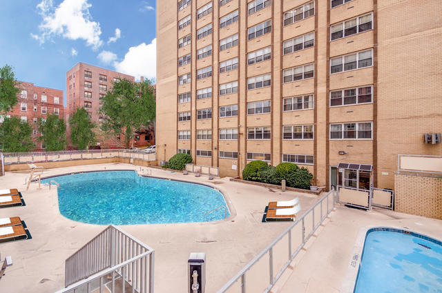 66-36 Yellowstone Boulevard, Unit 24A Queens, NY 11375 - Photo 17 of 20 a view of a swimming pool with outdoor seating