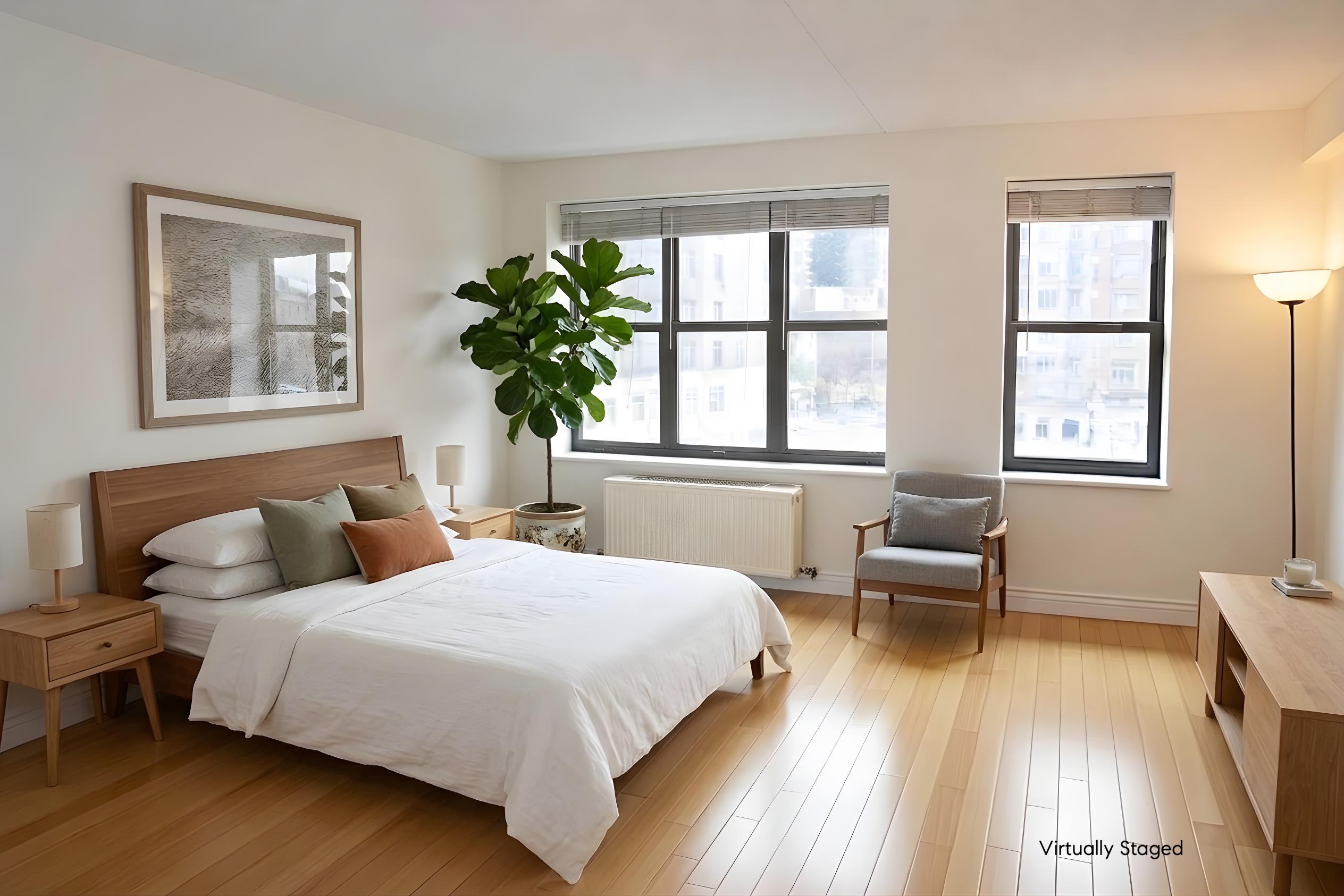 516 West 47th Street, Unit S4D Manhattan, NY 10036 - Photo 1 of 10 a bedroom with a bed and a window
