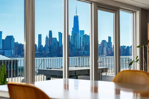a view of a balcony with floor to ceiling window