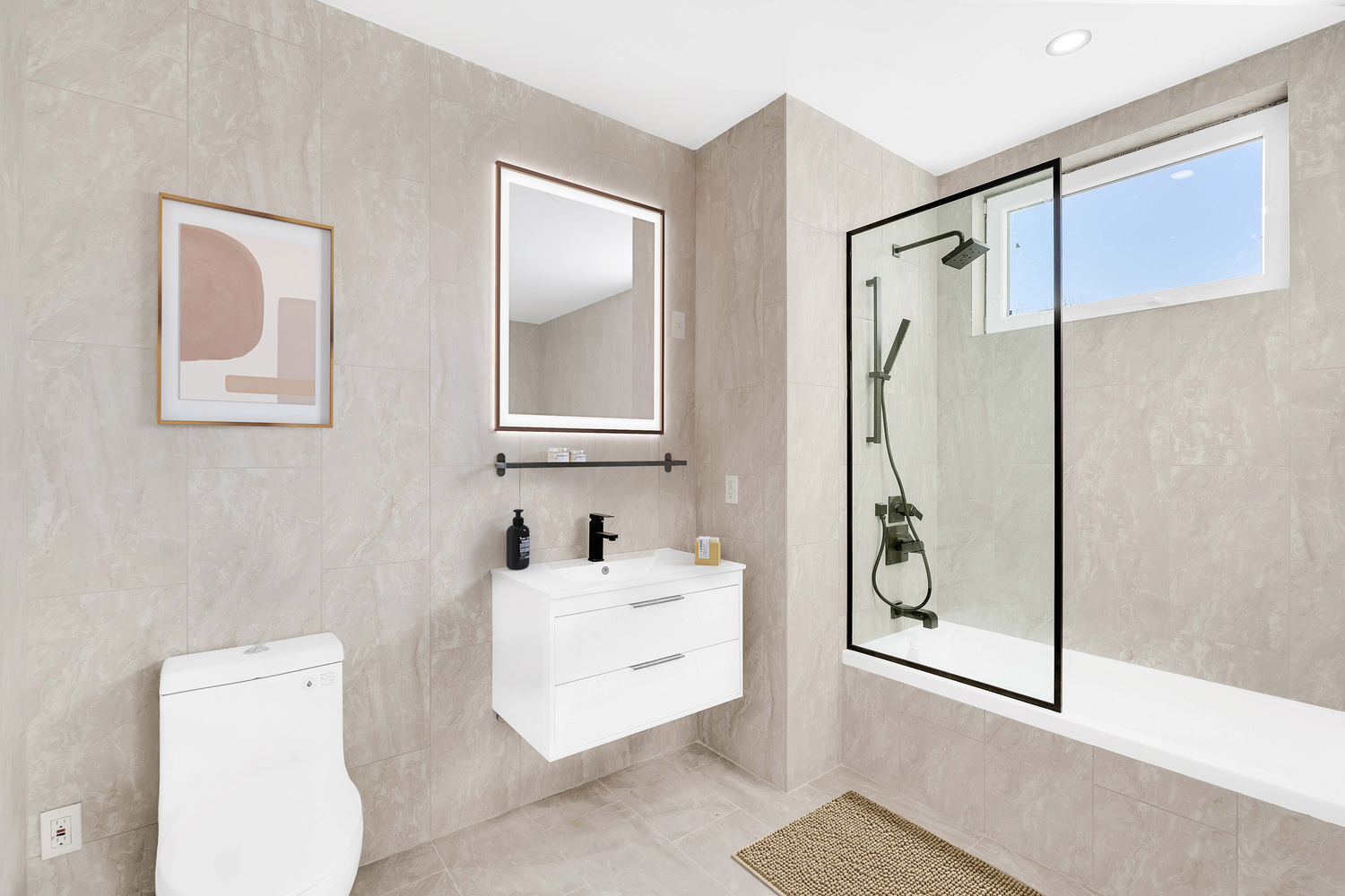 228 Vanderbilt Avenue, Unit 4A Brooklyn, NY 11205 - Photo 7 of 14 a bathroom with a sink a mirror and a shower