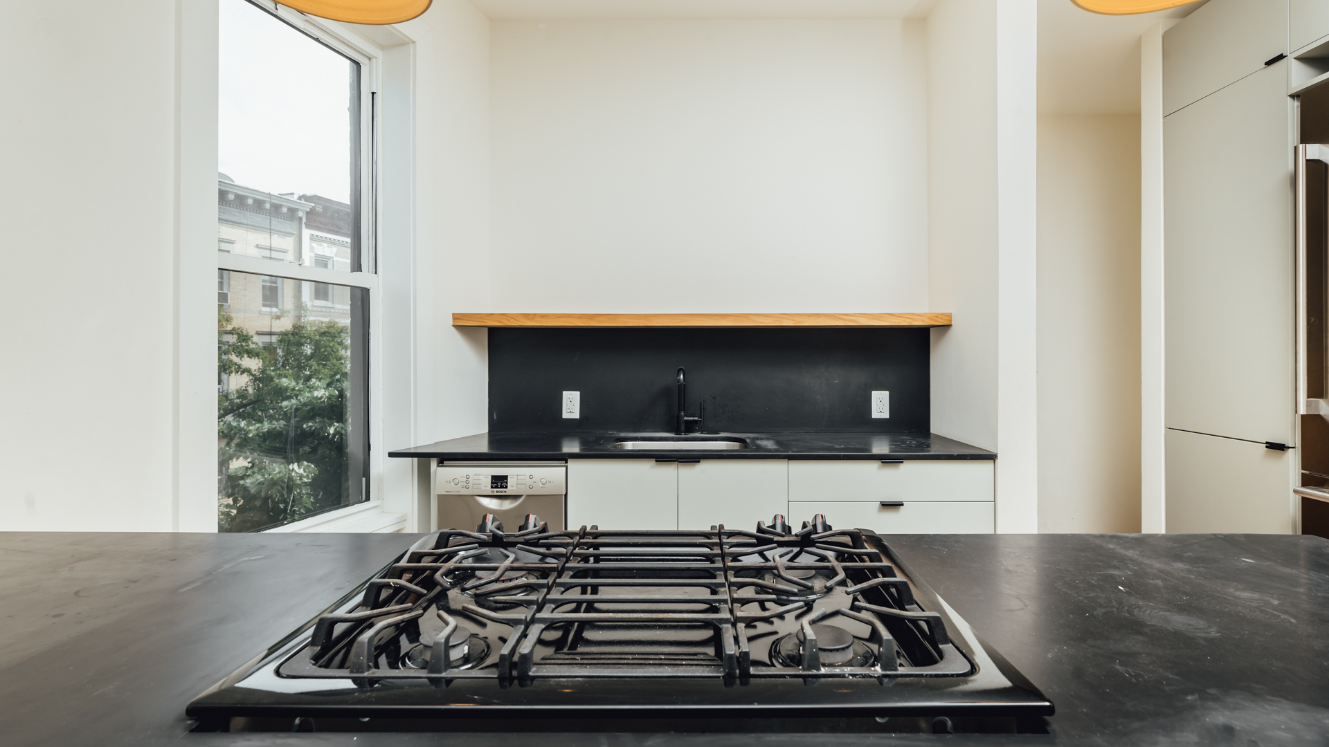 880 Woodward Avenue, Unit 2 Queens, NY 11385 - Photo 4 of 18 a living room with furniture and a flat screen tv