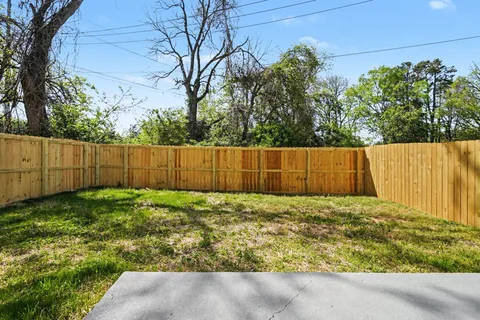 a view of backyard with green space