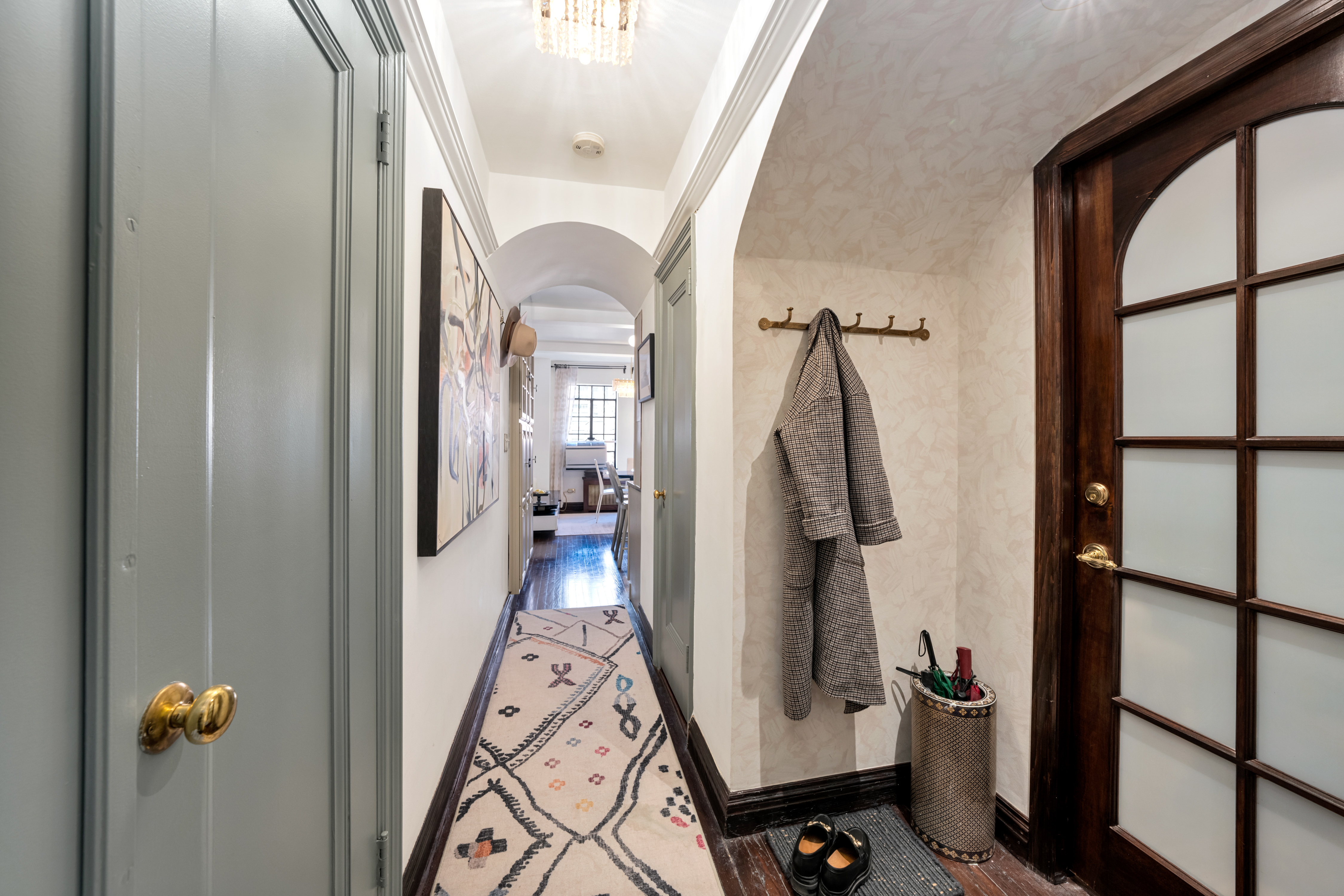 5 Tudor City Place, Unit 811 Manhattan, NY 10017 - Photo 2 of 14 a view of a hallway with wooden floor and staircase