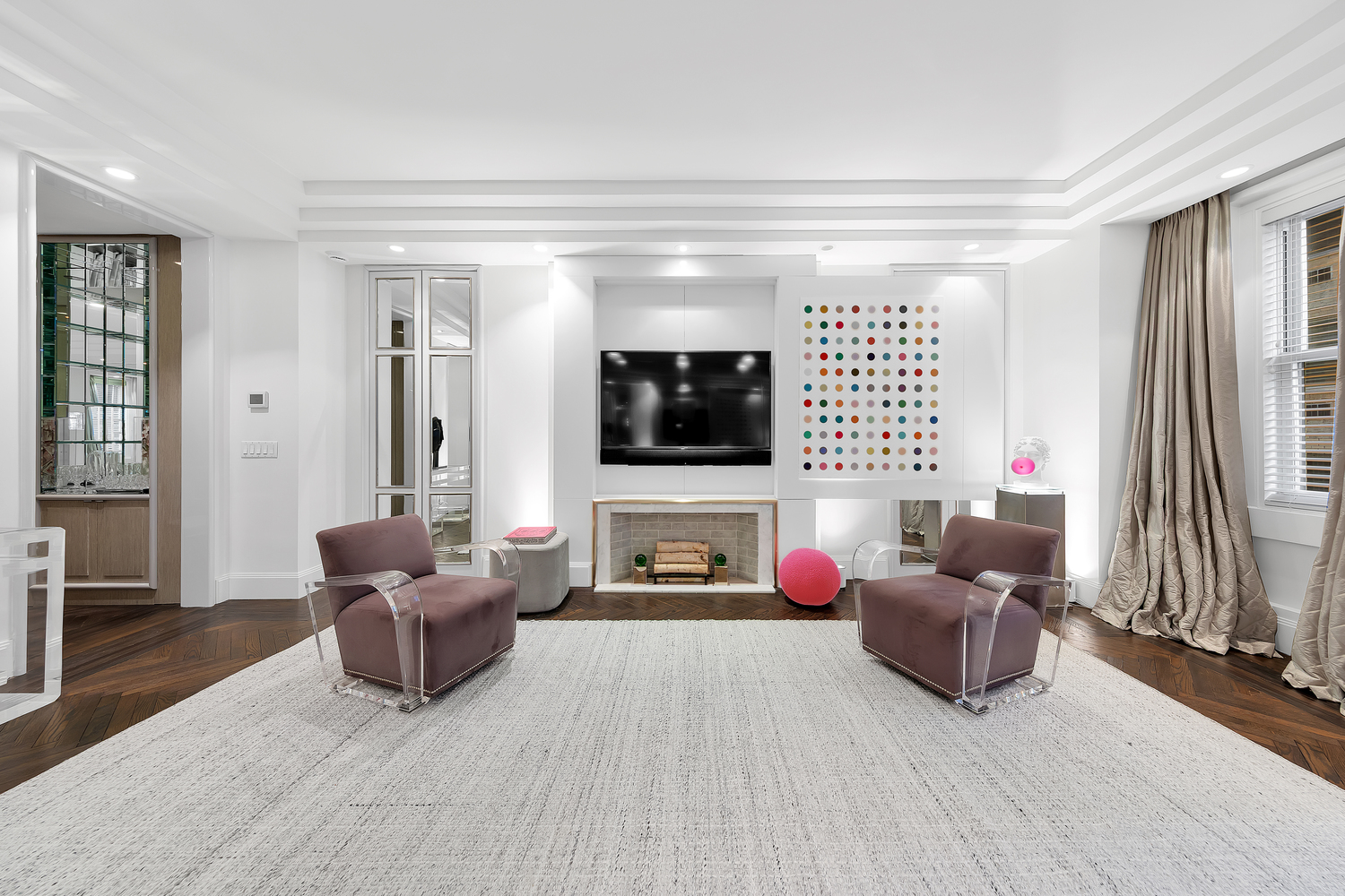 465 Park Avenue, Unit 9F Manhattan, NY 10022 - Photo 4 of 13 a living room with furniture and a flat screen tv