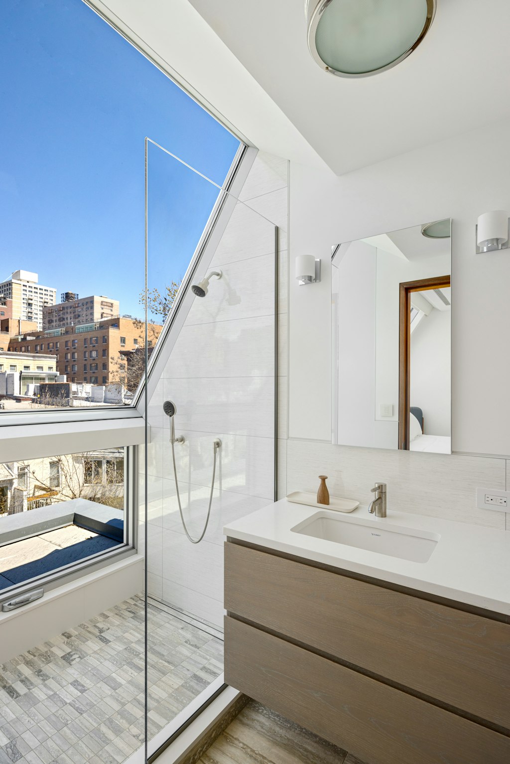 125 West 87th Street Manhattan, NY 10024 - Photo 22 of 27 a bathroom with a sink and a mirror