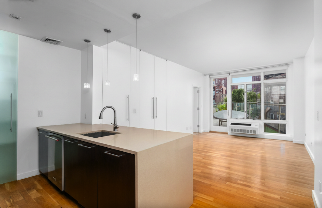 342 East 110th Street, Unit 3D Manhattan, NY 10029 - Photo 2 of 15 a kitchen with a sink and a window
