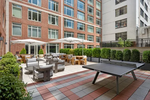 a view of a building and outdoor seating