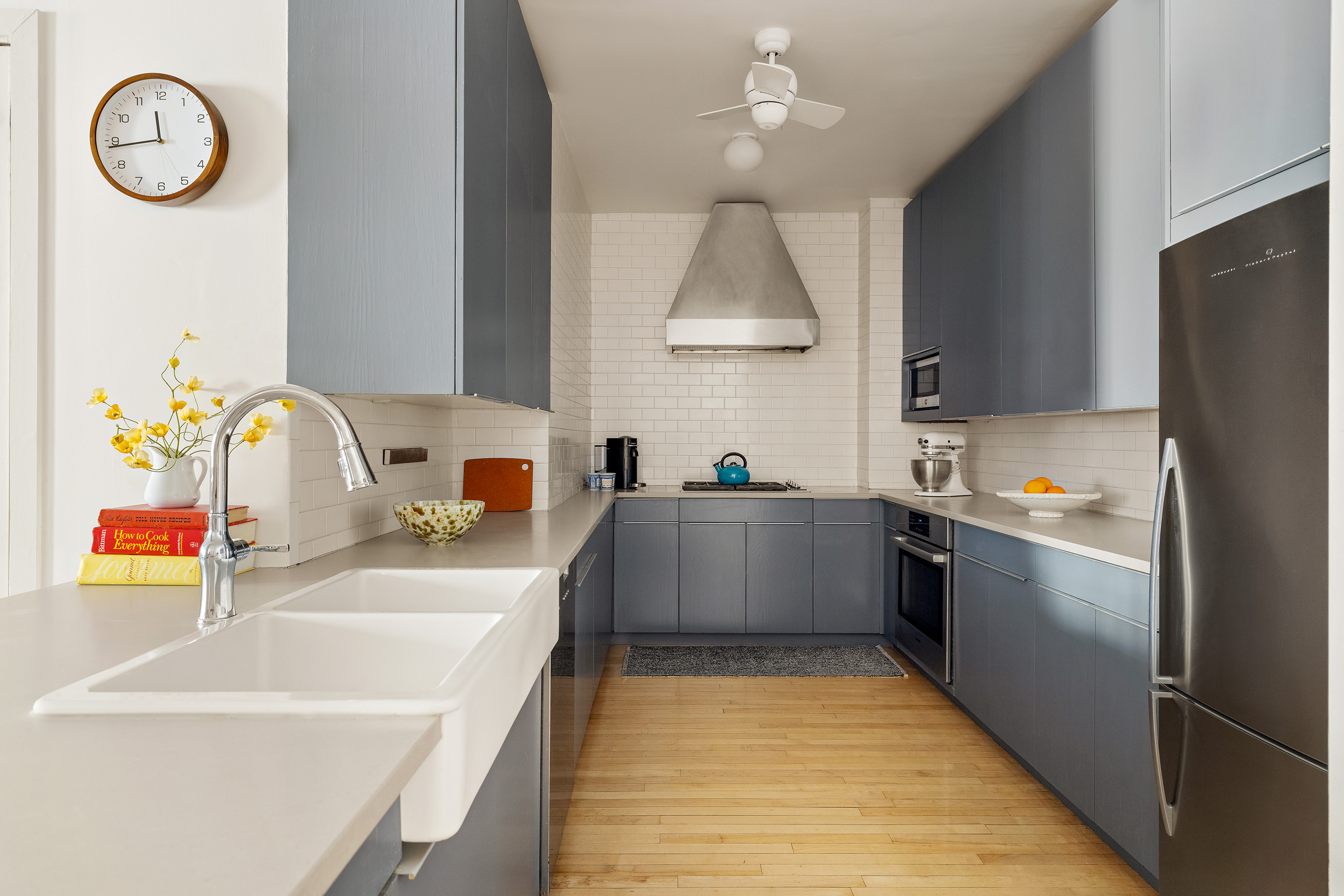 20 Jay Street, Unit 2/3C Manhattan, NY 10013 - Photo 6 of 16 a kitchen with stainless steel appliances granite countertop a sink a stove and a refrigerator