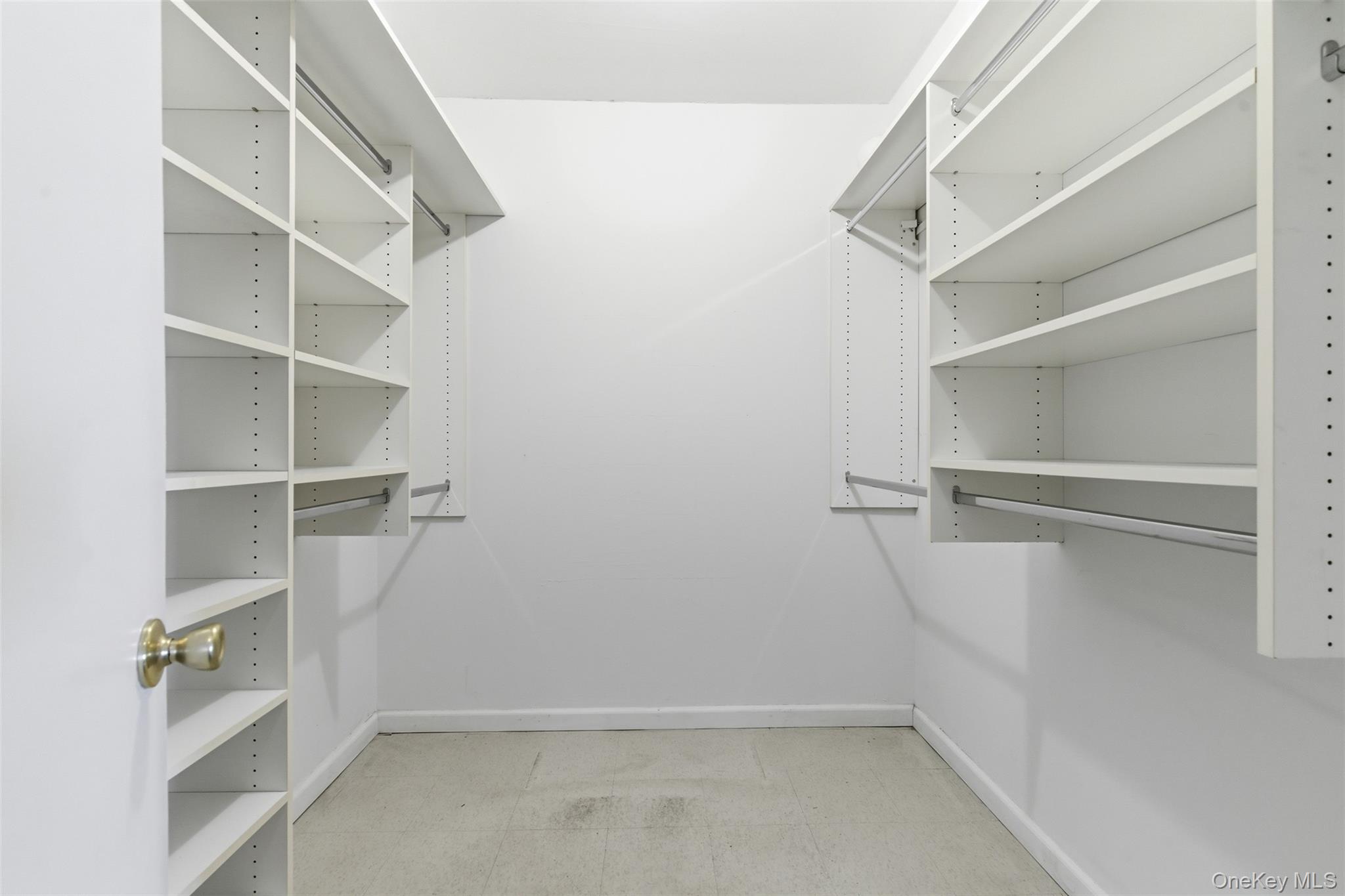 27110 Grand Central Parkway, Unit 26A Queens, NY 11005 - Photo 13 of 30 a view of walk in closet with empty racks
