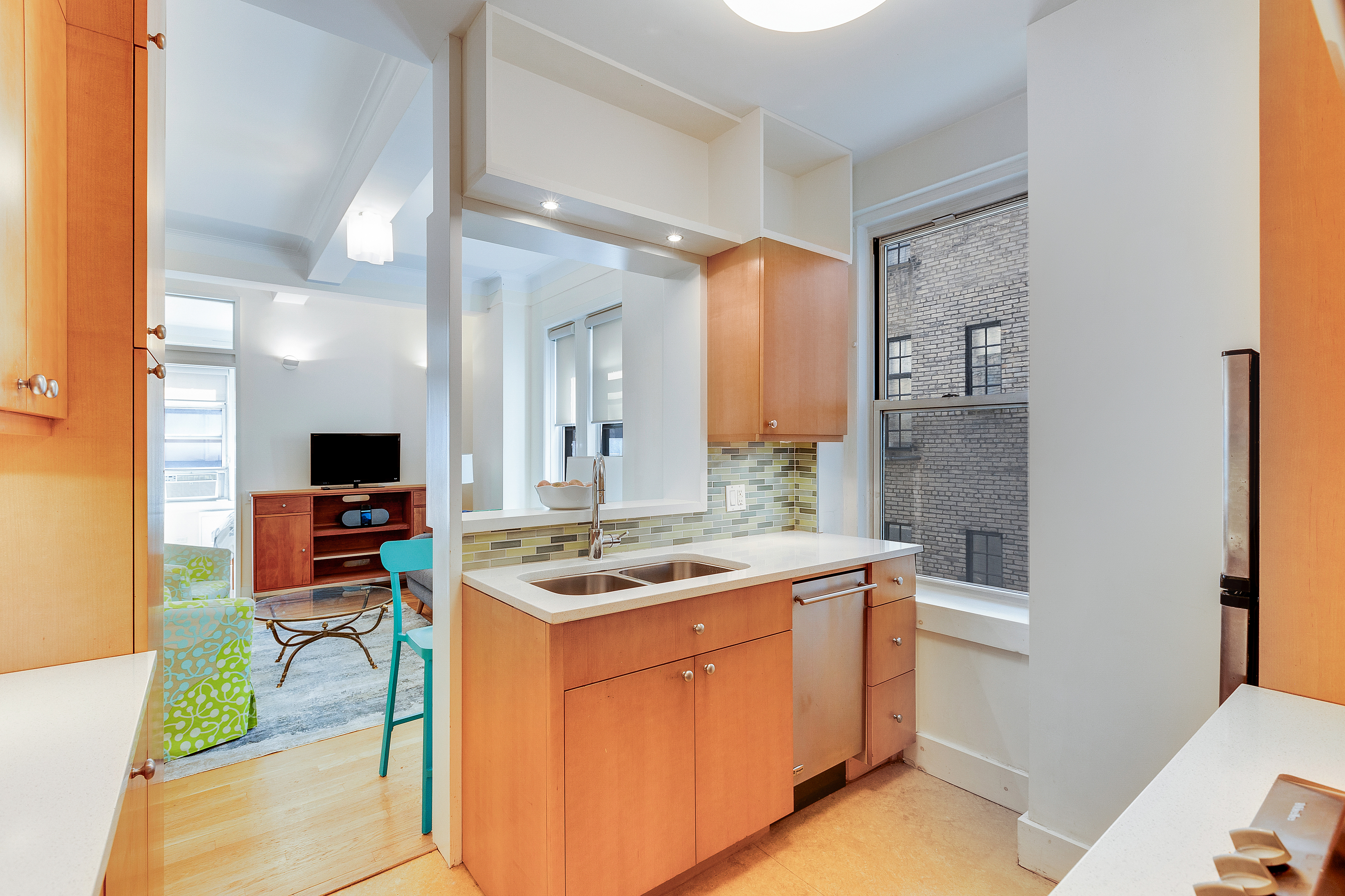 588 West End Avenue, Unit 6D Manhattan, NY 10024 - Photo 6 of 9 a kitchen with stainless steel appliances granite countertop a stove and a sink