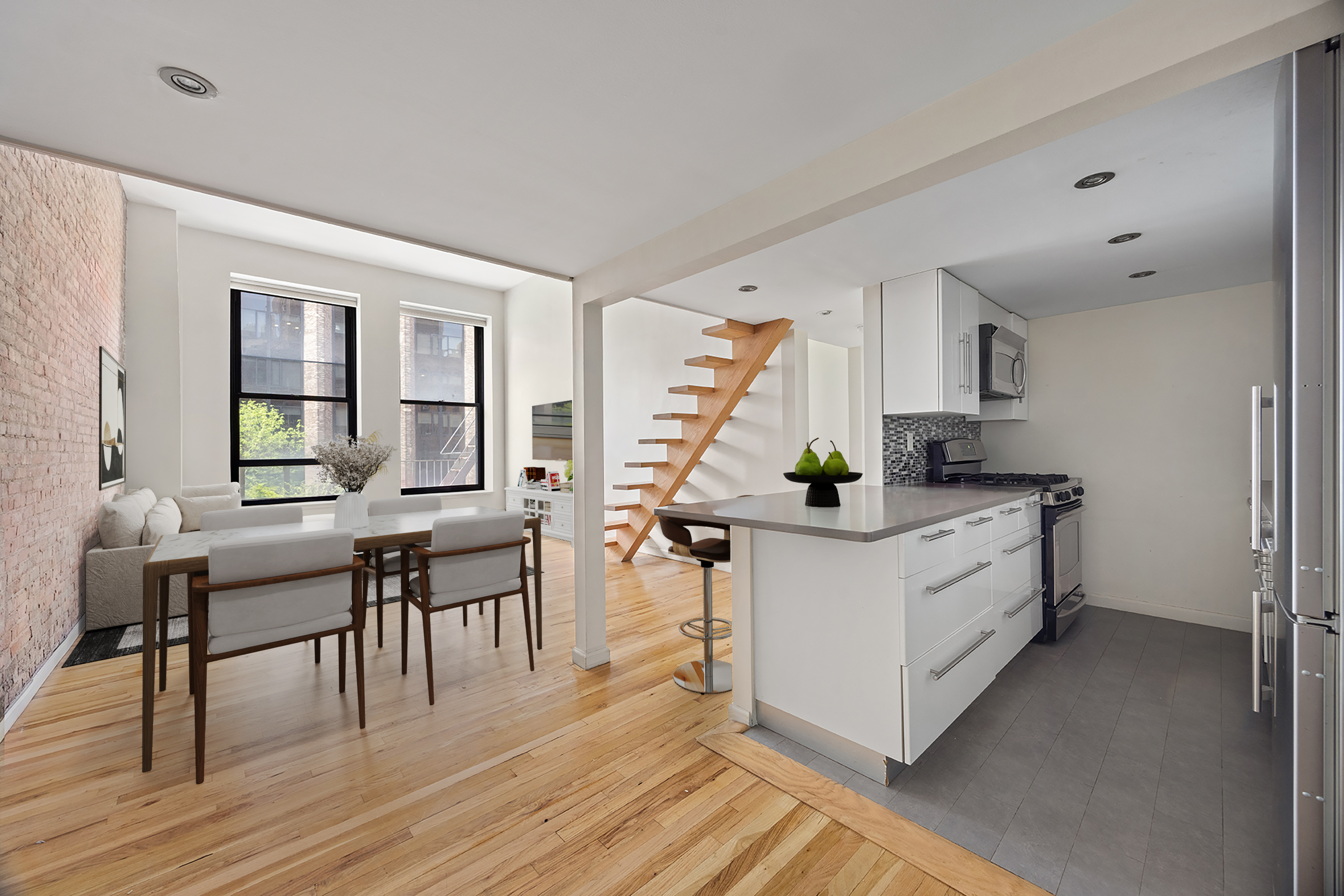 250 Mercer Street, Unit C414 Manhattan, NY 10012 - Photo 4 of 14 a kitchen with stainless steel appliances white cabinets and wooden floor