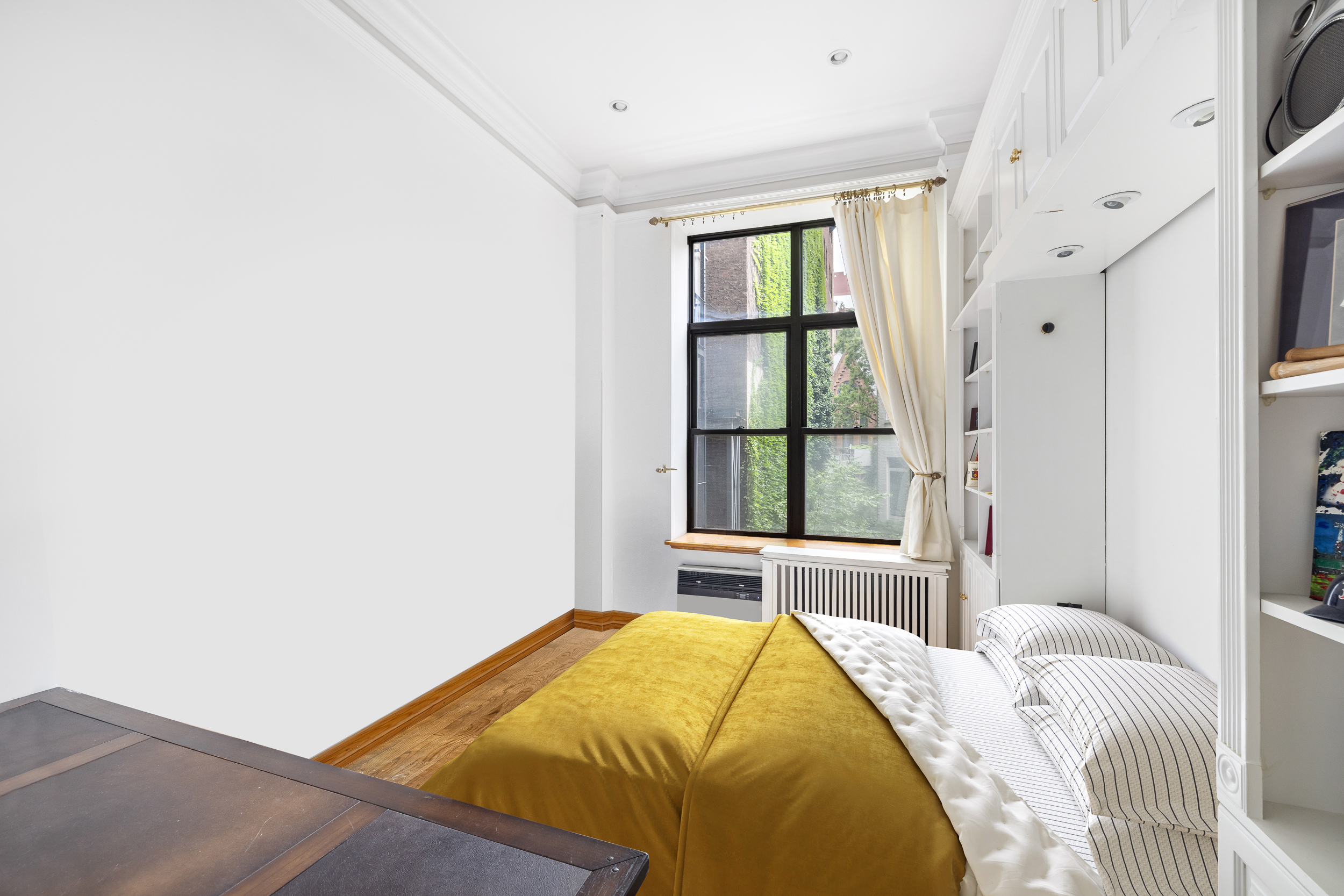 7 Gramercy Park West, Unit 2D Manhattan, NY 10003 - Photo 9 of 11 a bedroom with a bed and a window