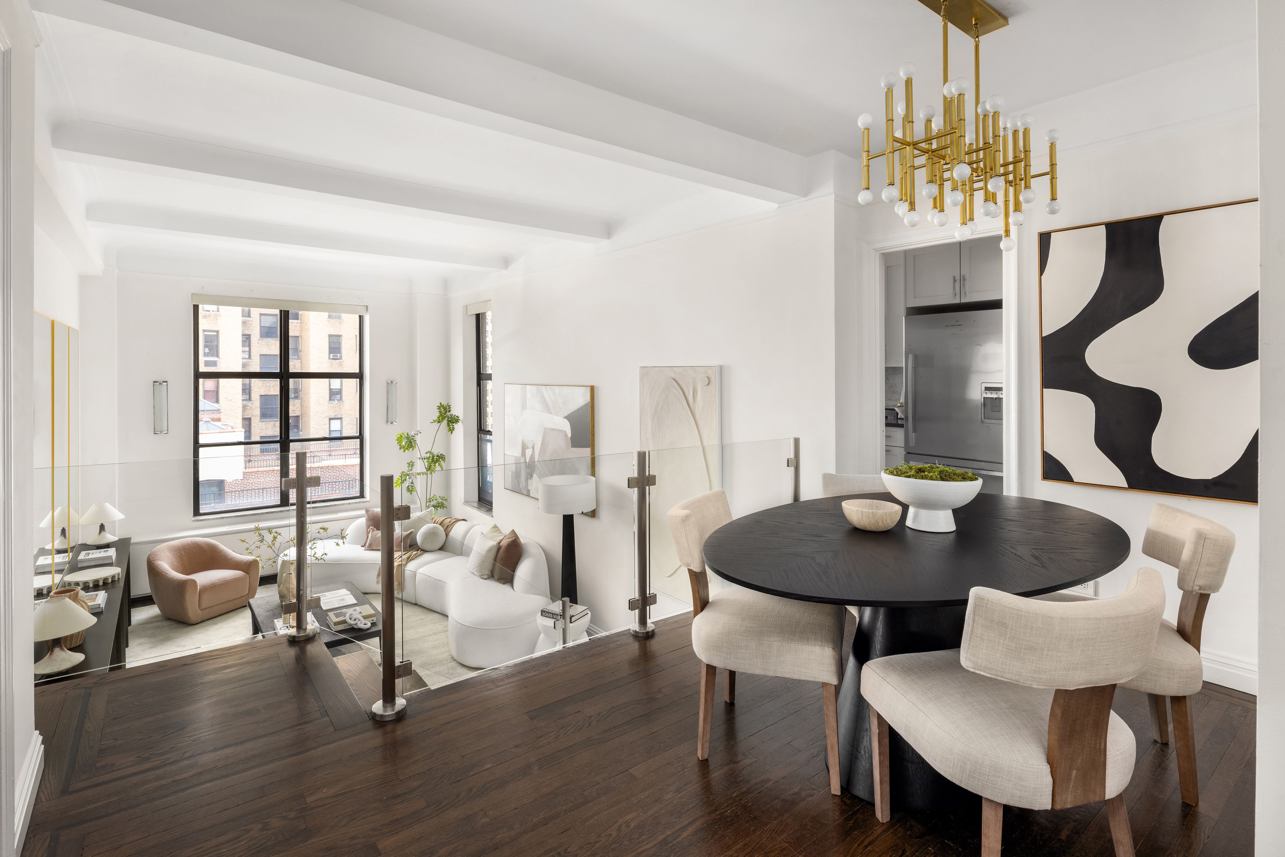 49 East 96th Street, Unit 9B Manhattan, NY 10128 - Photo 5 of 15 a view of a dining room with furniture and chandelier