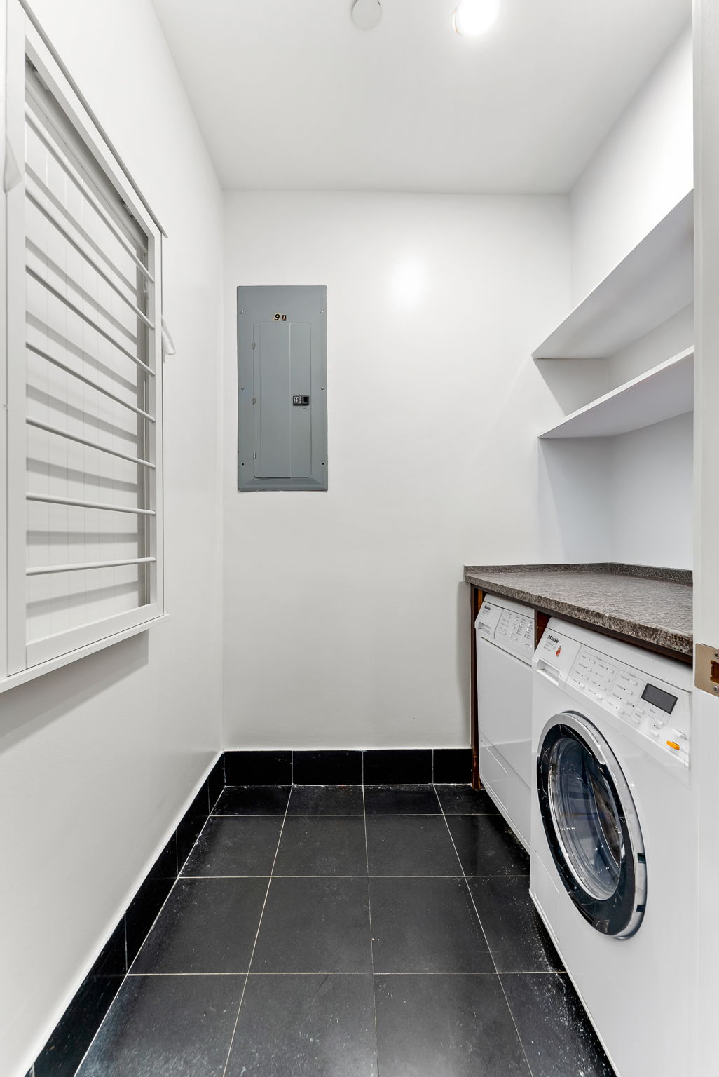 15 West 20th Street, Unit 9A Manhattan, NY 10011 - Photo 15 of 21 a view of storage and utility room with washer and dryer