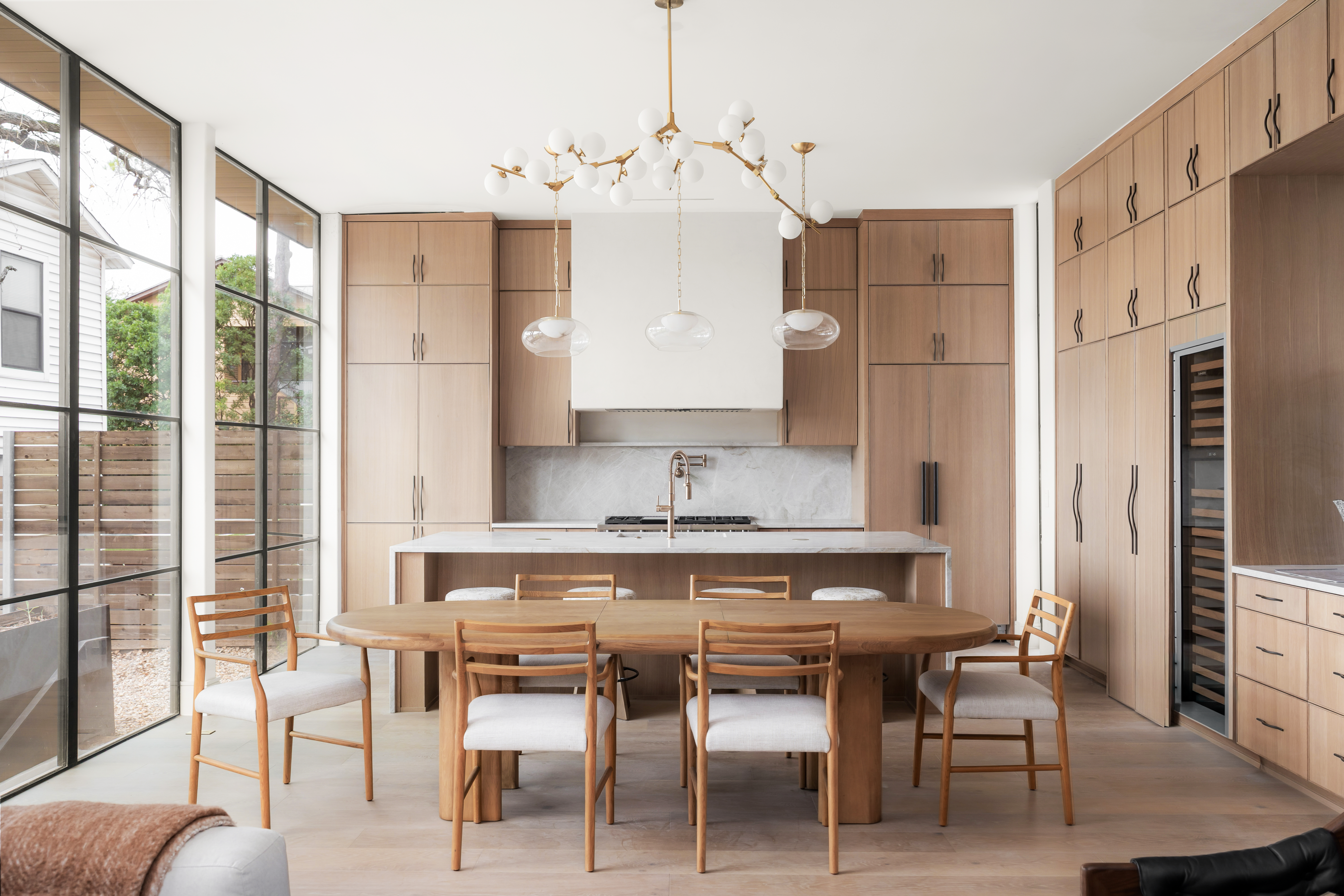 3411 Bridle Path Austin, TX 78703 - Photo 15 of 76 a kitchen with granite countertop a table chairs stove a refrigerator and cabinets