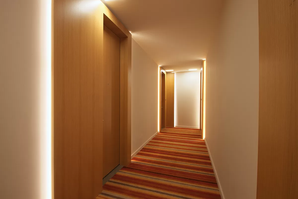 565 Broome Street, Unit N6J Manhattan, NY 10013 - Photo 12 of 27 a view of a hallway with wooden floor