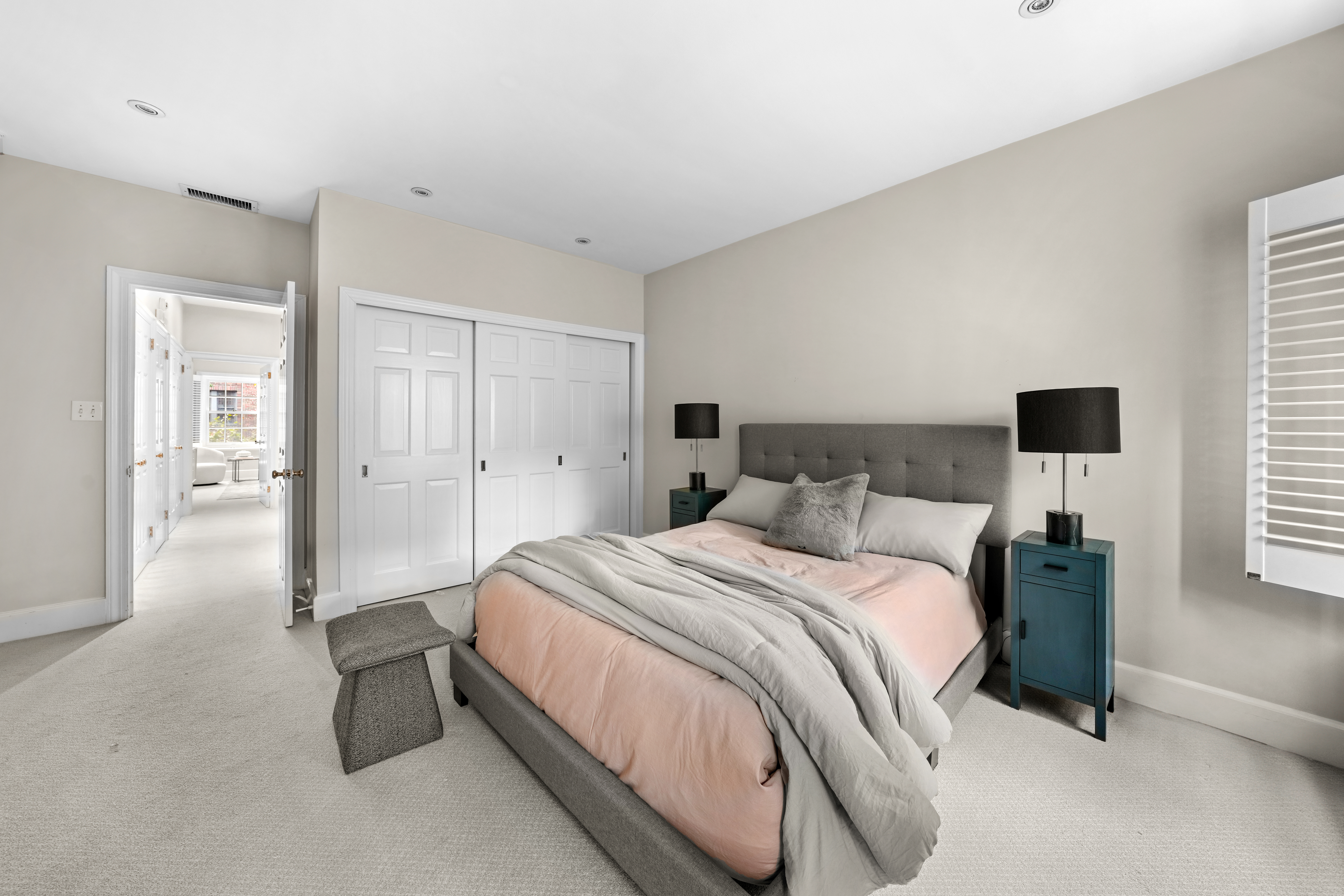 247 East 71st Street Manhattan, NY 10021 - Photo 24 of 31 a spacious bedroom with a bed and a window