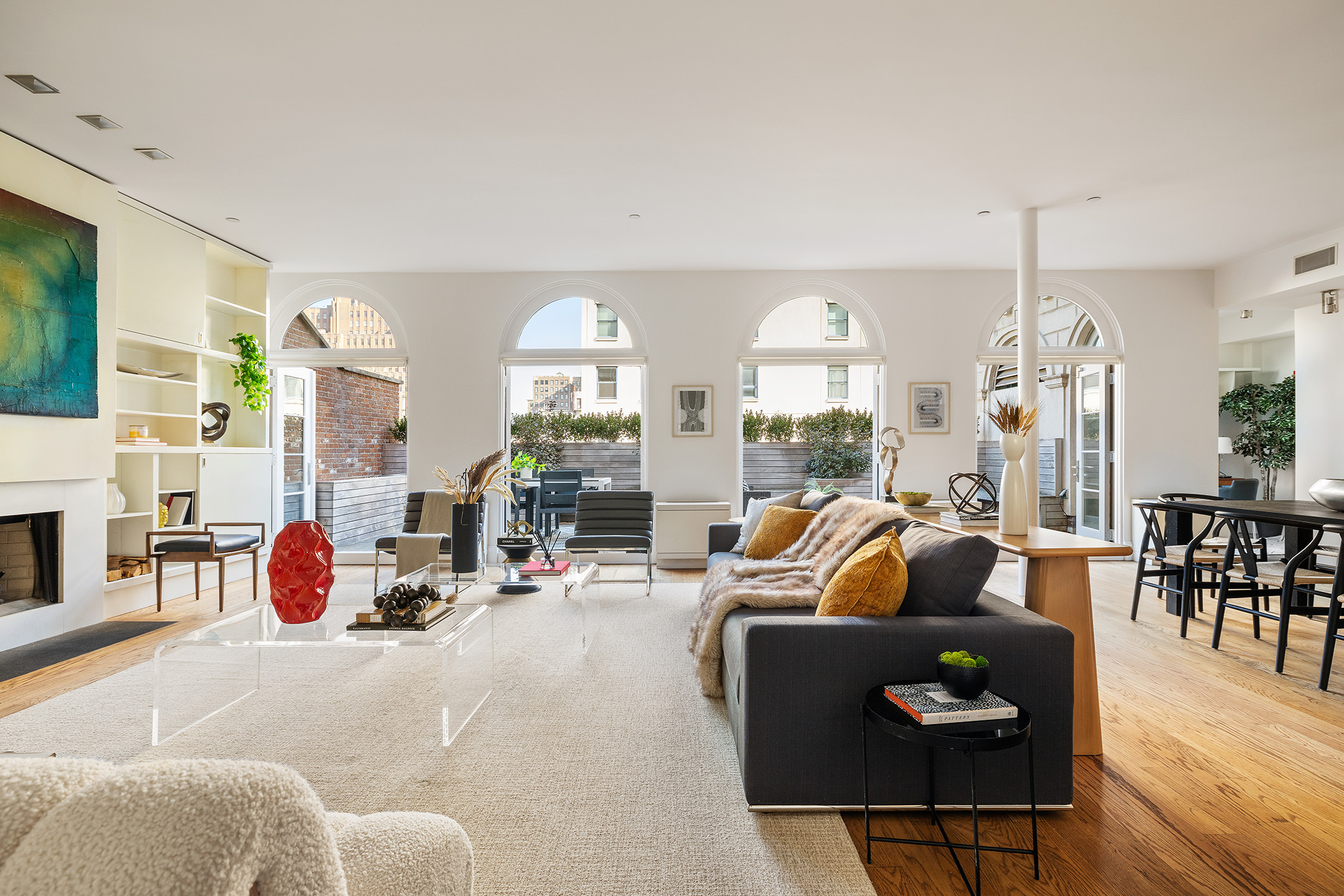 41 Warren Street, Unit 6 Manhattan, NY 10007 - Photo 2 of 23 a living room with furniture fireplace and a large window