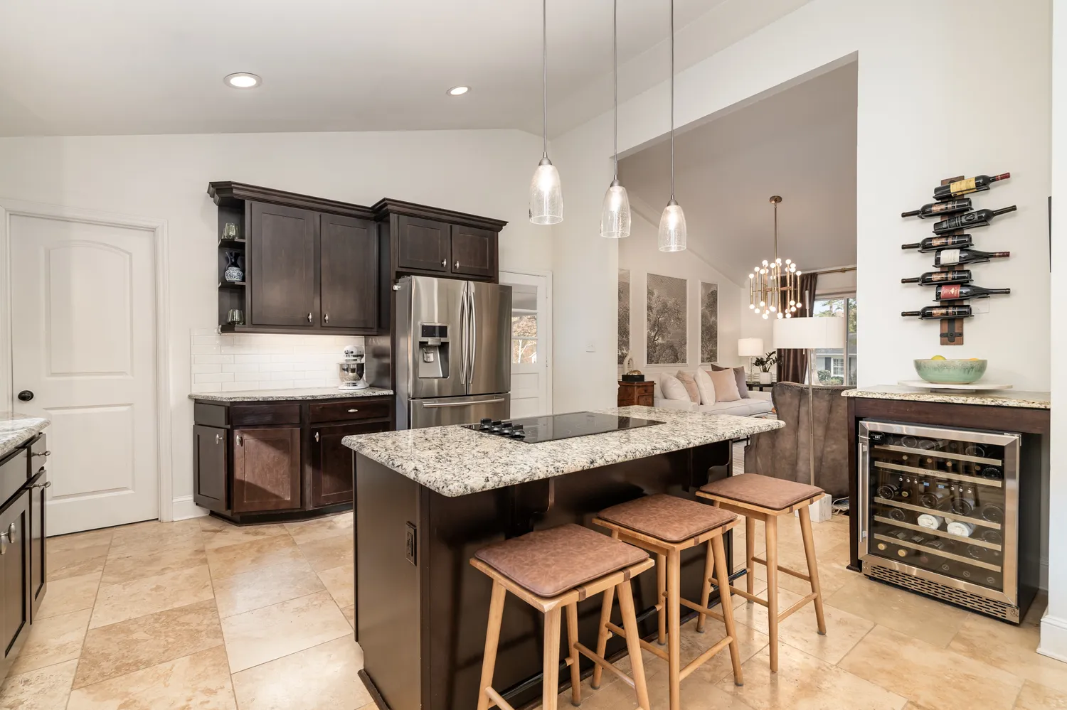 a large kitchen with a table and chairs