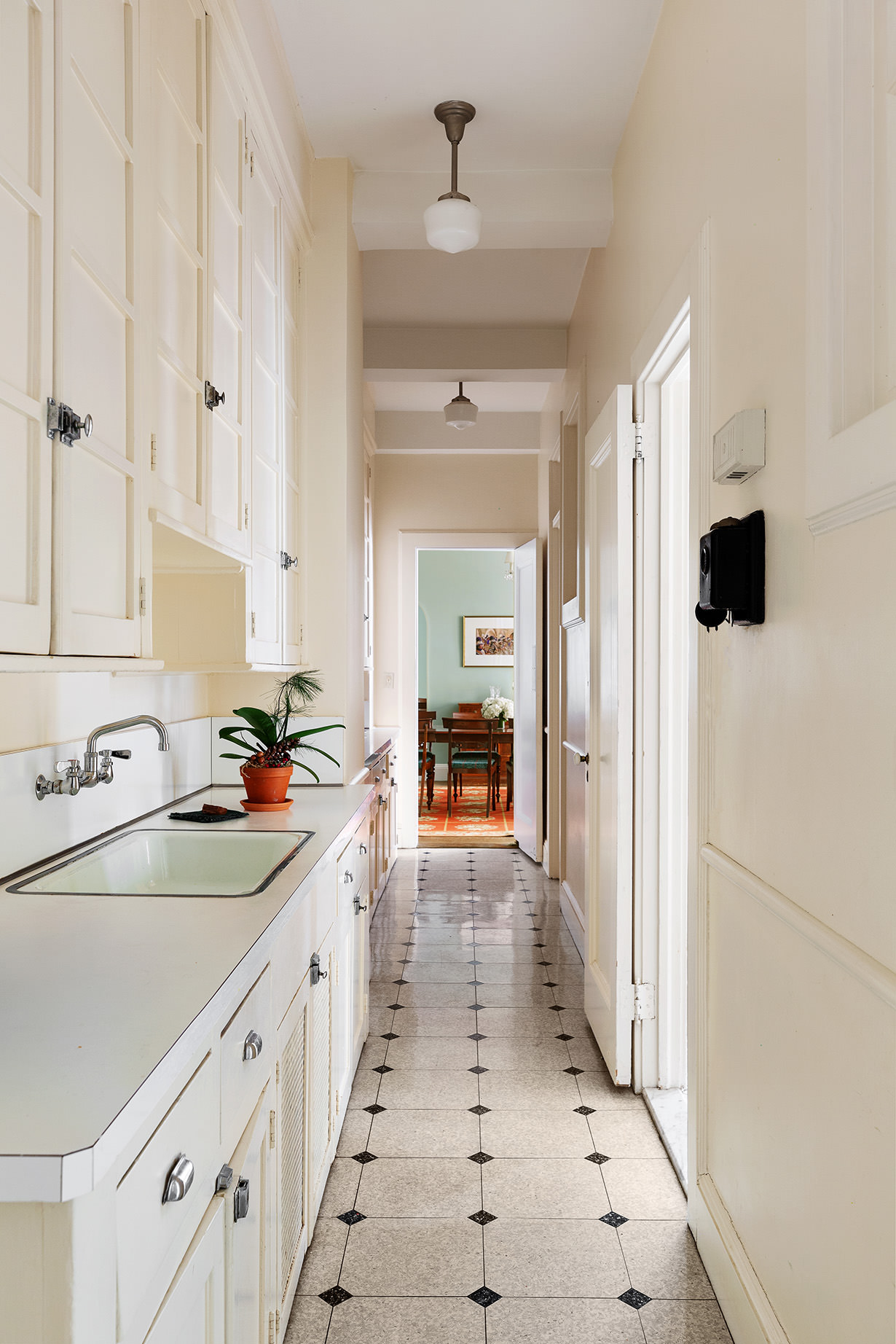 1115 5th Avenue, Unit 5B Manhattan, NY 10128 - Photo 11 of 19 a view of a kitchen with a sink and refrigerator