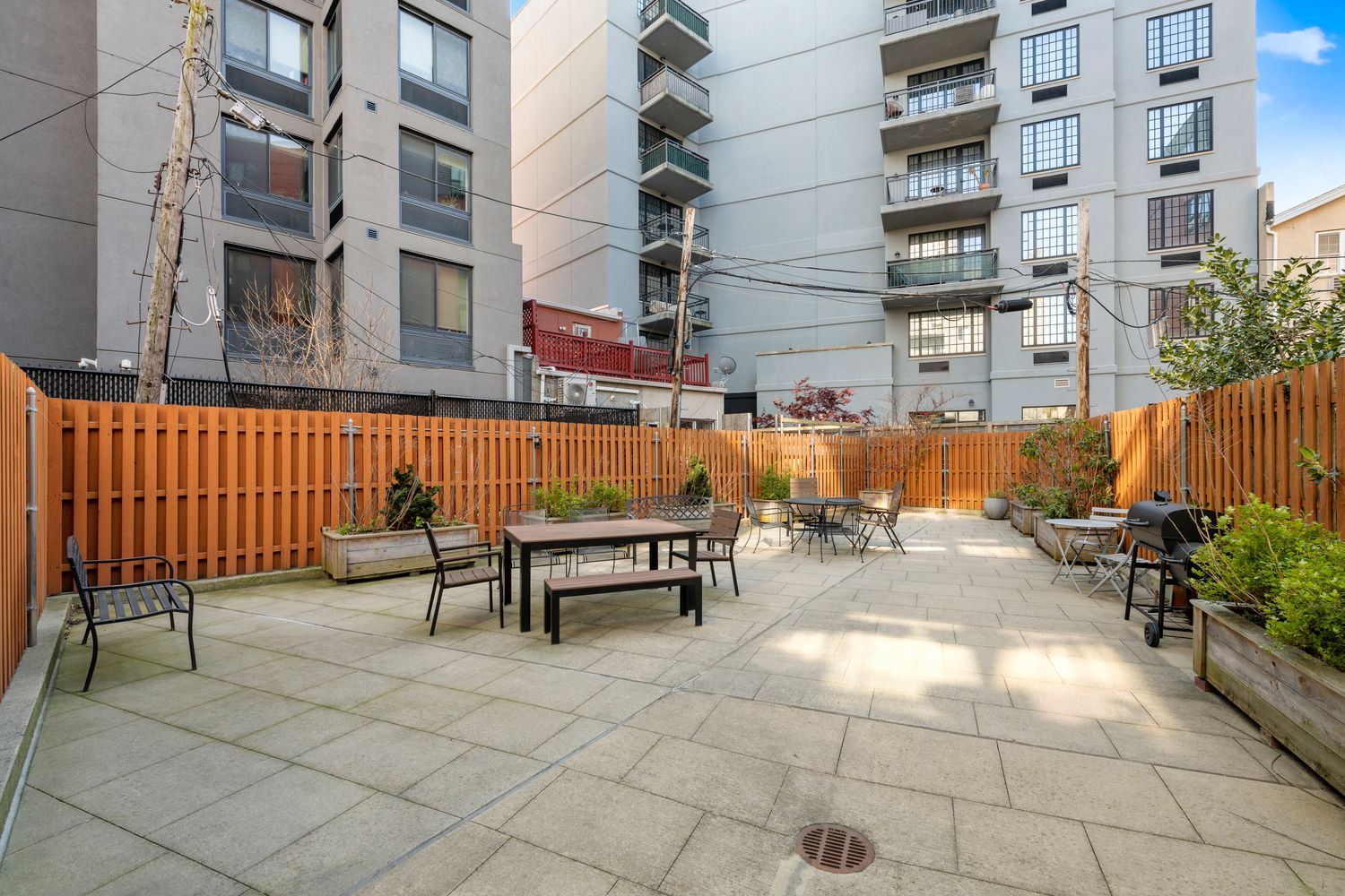 82 Irving Place, Unit 7C Brooklyn, NY 11238 - Photo 15 of 16 a view of a patio with table and chairs and potted plants