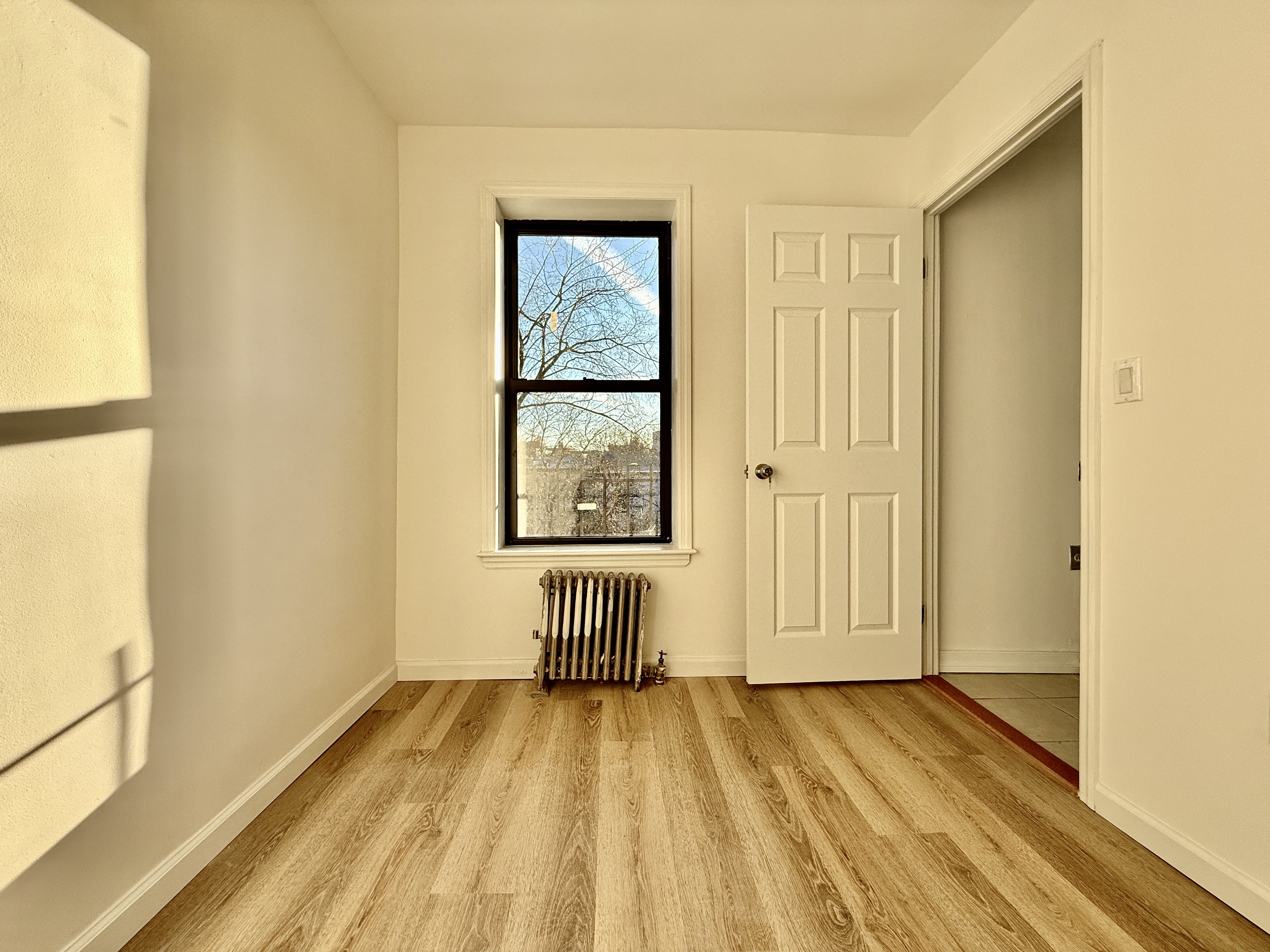 622 President Street, Unit 4 Brooklyn, NY 11215 - Photo 6 of 8 a view of a room with wooden floor and doors