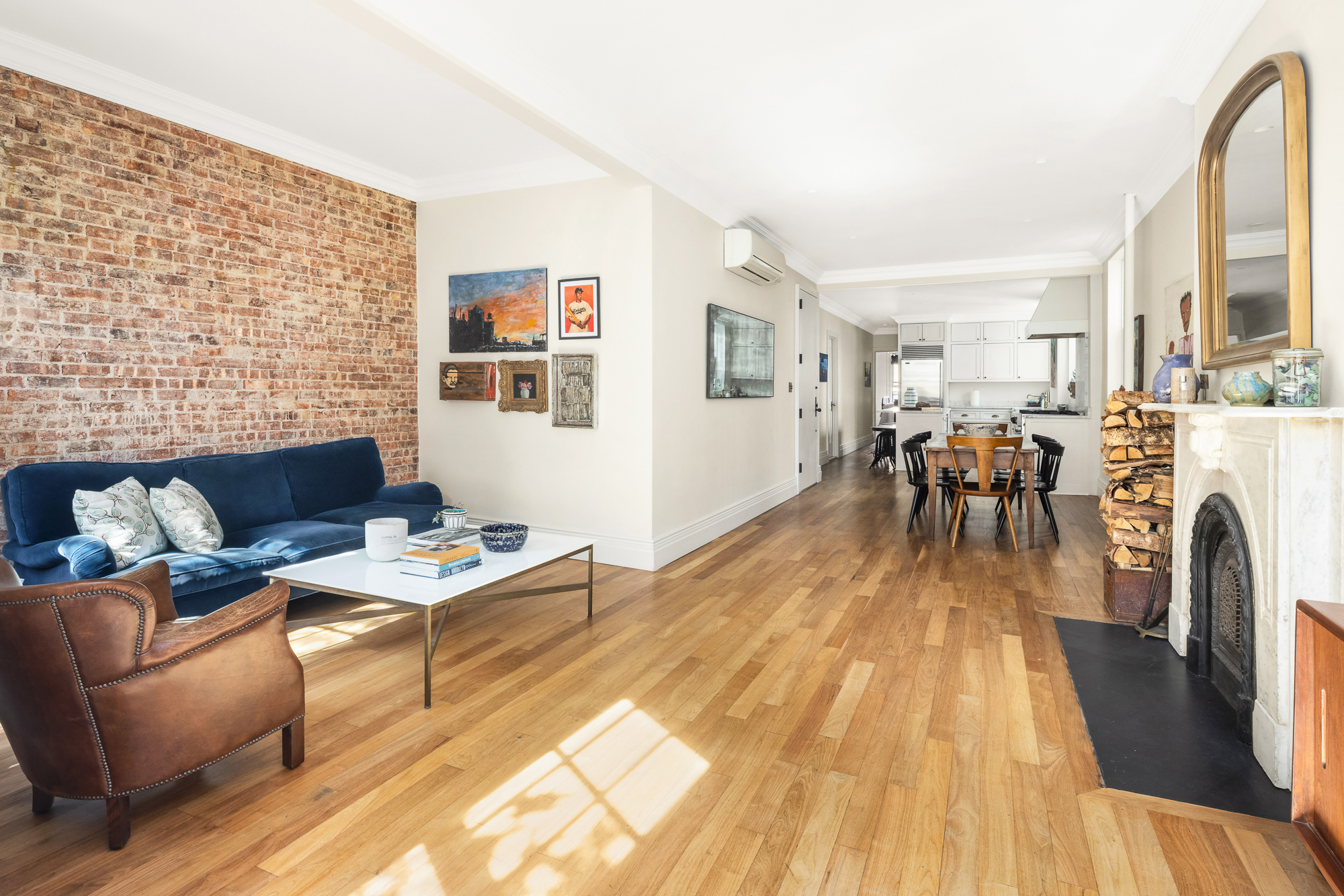 67 Perry Street, Unit 4 Manhattan, NY 10014 - Photo 6 of 15 a living room with furniture and a fireplace
